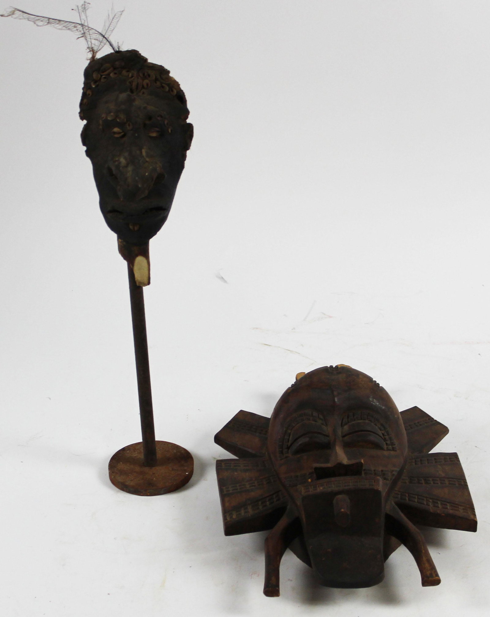 Two Masks: Small decorative African mask 14" most likely from Democratic Republic of Congo some losses, and Sepik River Totem from Papua New Guinea 7"