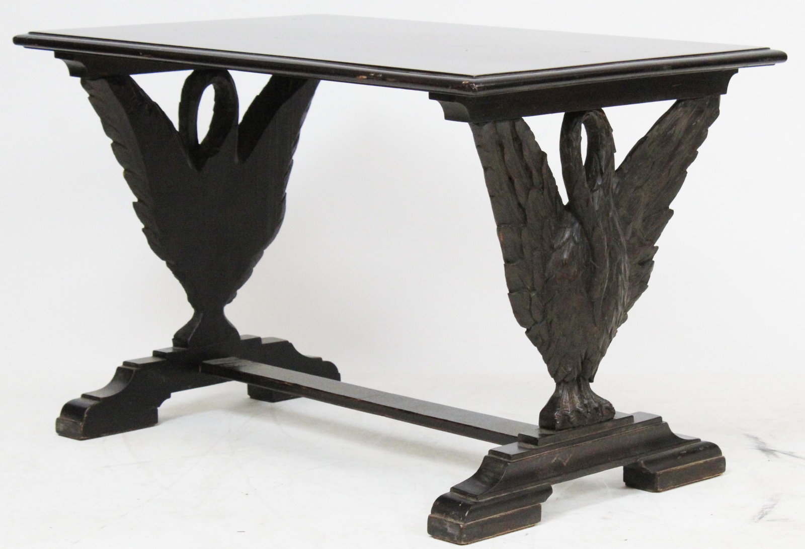 ca. 1920 Figural Carved Phoenix Base End Table: ca. 1920 mahogany stained birch end table with two unusual carved figural phoenix supports on trestle base 19" x 30" x 19"