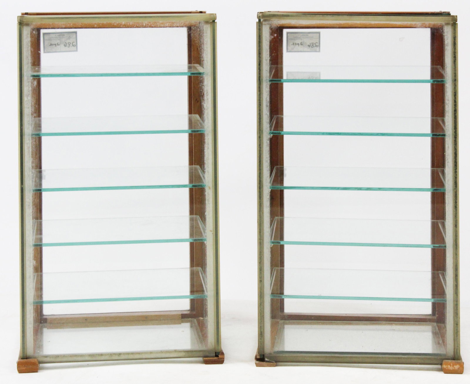 Pair of 20th c. Glass Counter Top Display Cases: Pair of small mid 20th c. glass counter top display cases with 5 interior shelves and stained hardwood frame, made by The Waddell Co. Inc. Greenfield, Ohio , possibly optometrists show cases for eye g