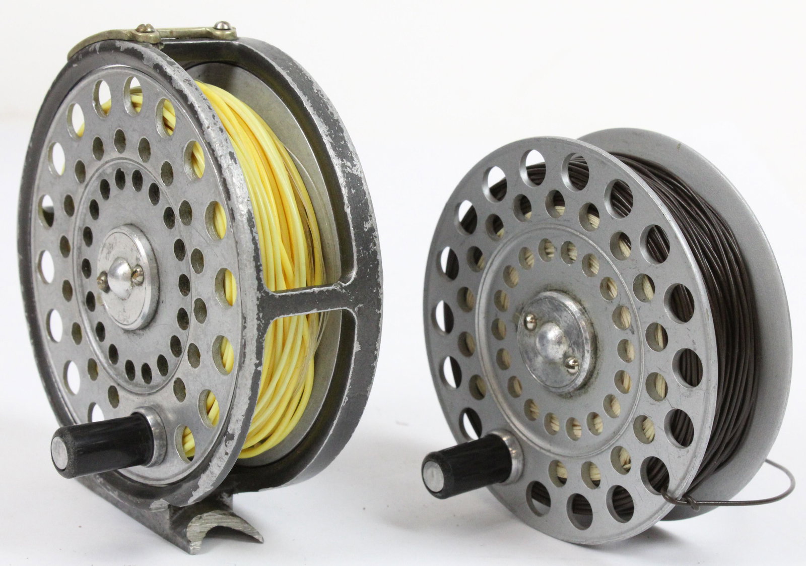 Vintage Hardy Lightweight Fly Reel: A vintage Hardy L H K Lightweight fly reel. 3 1/8" diameter. Worn, with extra spool.