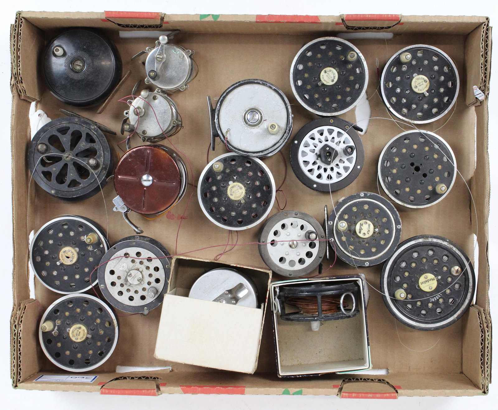 Collection Vintage Fly Reels: Collection vintage fly reels including 2 19th c nickel reels, Weber Futurist, Pflueger, Ocean City in original box, 2 automatic reels one in original box. 7 extra medalist spools.