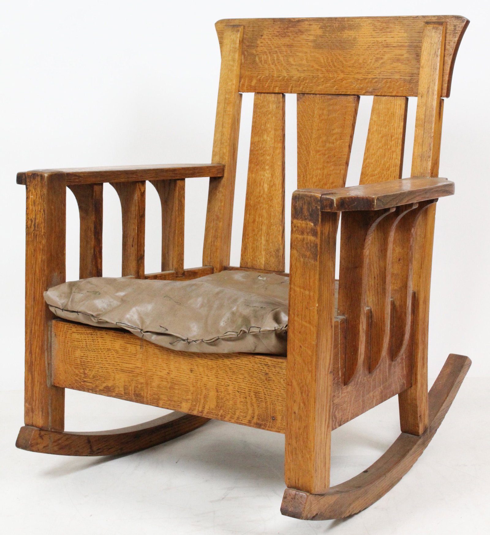 Two Mission Style Oak Rocking Chairs: Two ca. 1910 Arts and Crafts era mission oak slat back flat arm rocking chairs approx. 40" x 2&" x 33" -refinished, later upholstery with wear