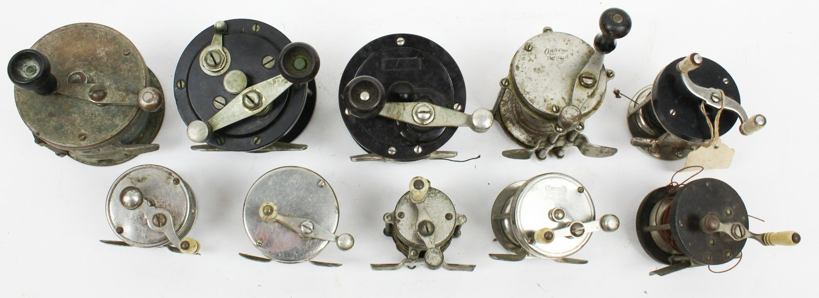 10 19th c Reels: A group of 10 19th c fishing reels. Unmarked, bakelite, nickel plated, 4 Brothers, Arrow Brand.