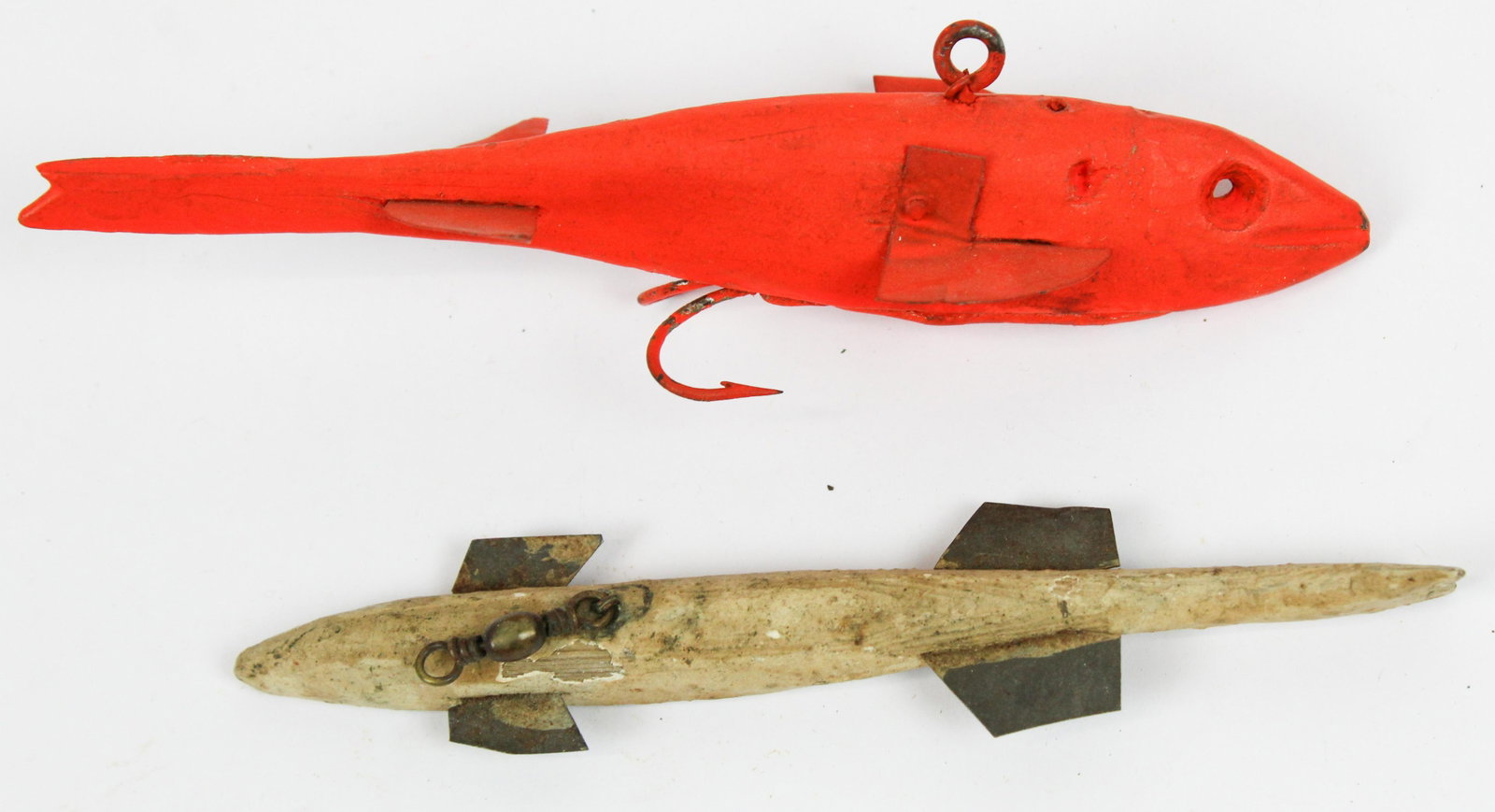 Two 1920's Lake Champlain Fish Decoys: Two ca. 1920's lake Champlain Vermont ice spear fishing decoys. 5 1/2" long. One in original paint other repainted orange with hooks added to bottom.
