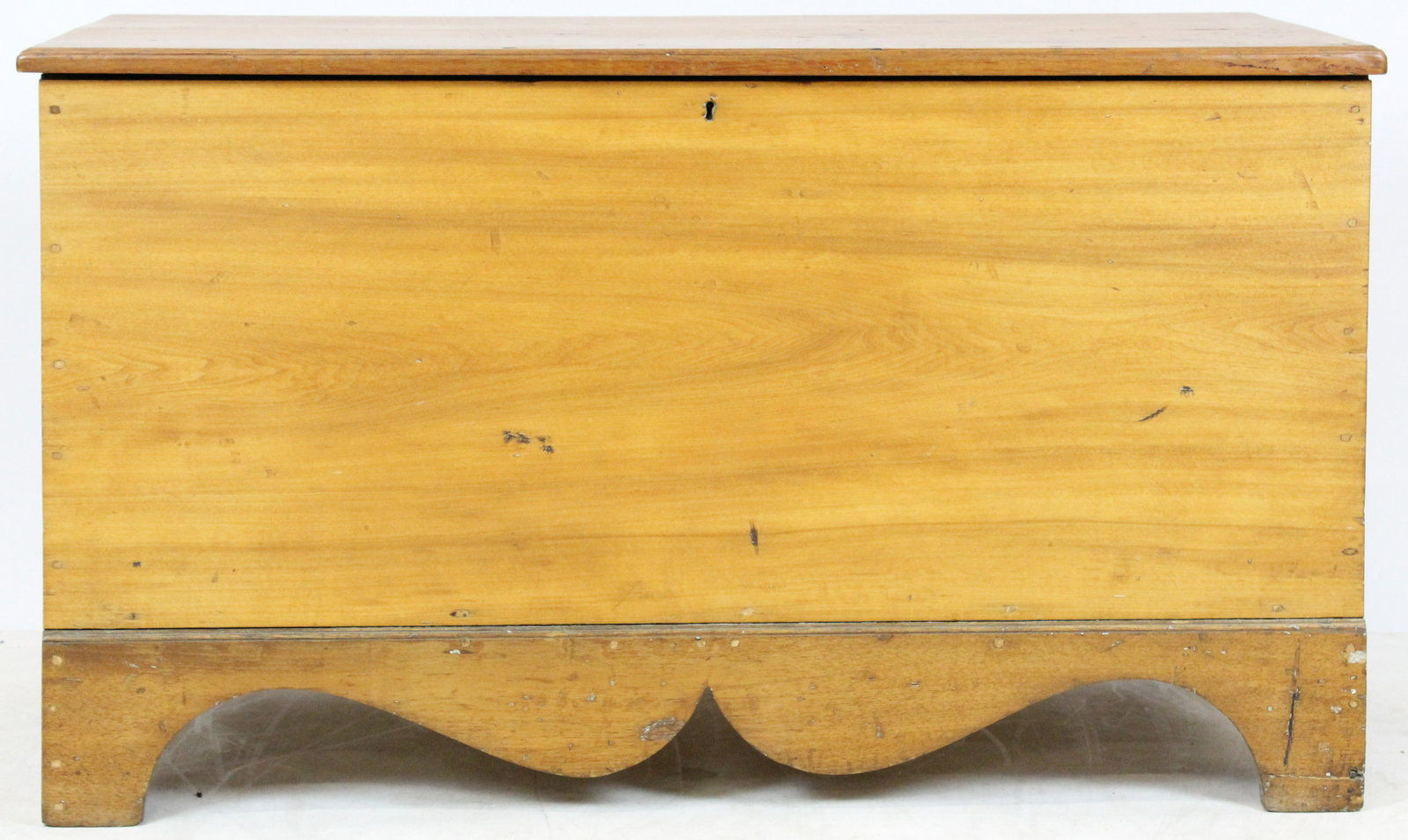 19th c. Refinished Bootjack Blanket Chest: 19th c. refinished country basswood and butternut blanket chest with shaped skirt and bootjack ends, very good overall condition 25" x 43" x 19"