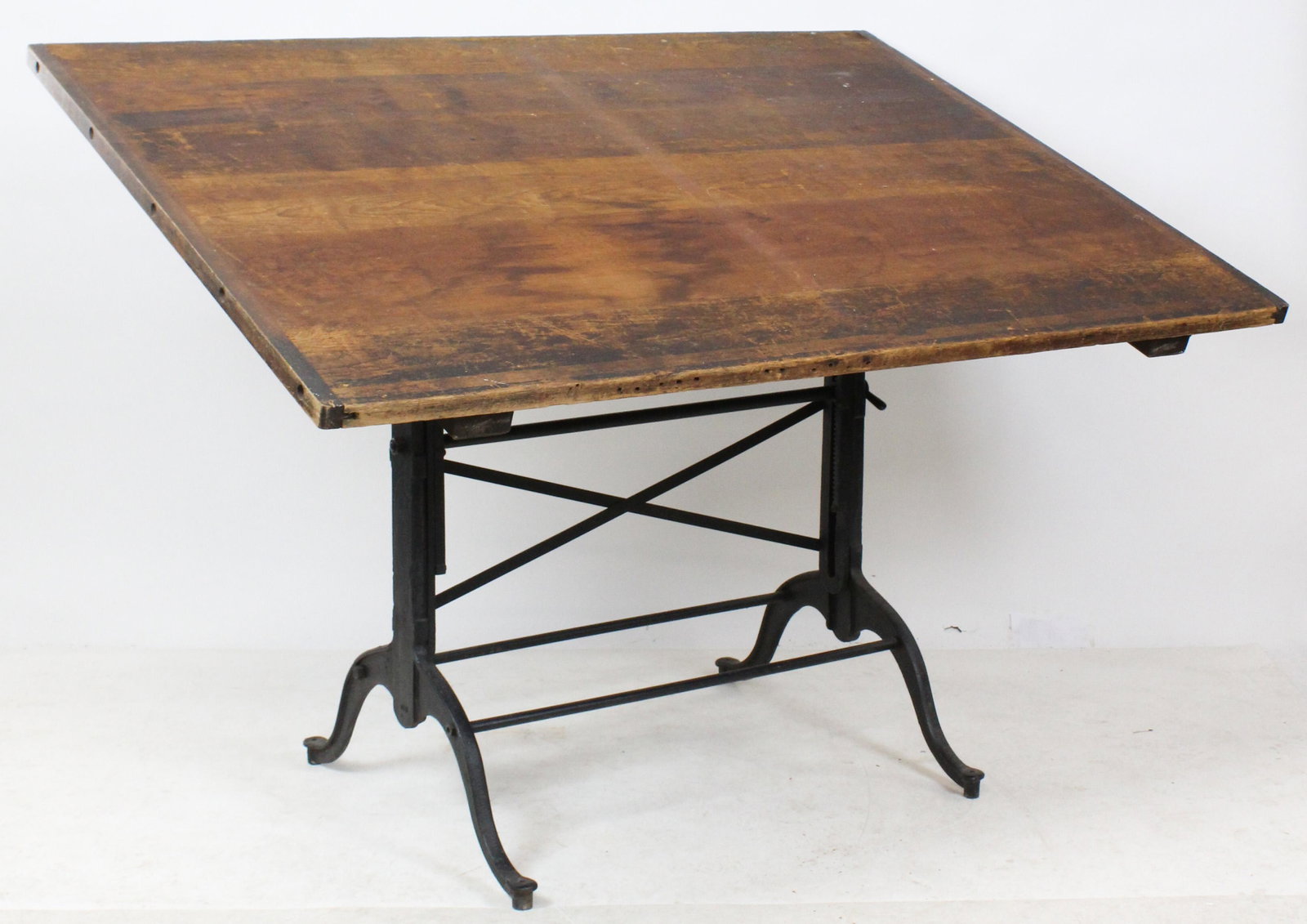 Early 20th c. Cast Iron Base Drafting Table: Early 1900's drafting table with pine top having hardwood breadboard ends, on delicate cast iron adjustable base 37" x 60" x 43"