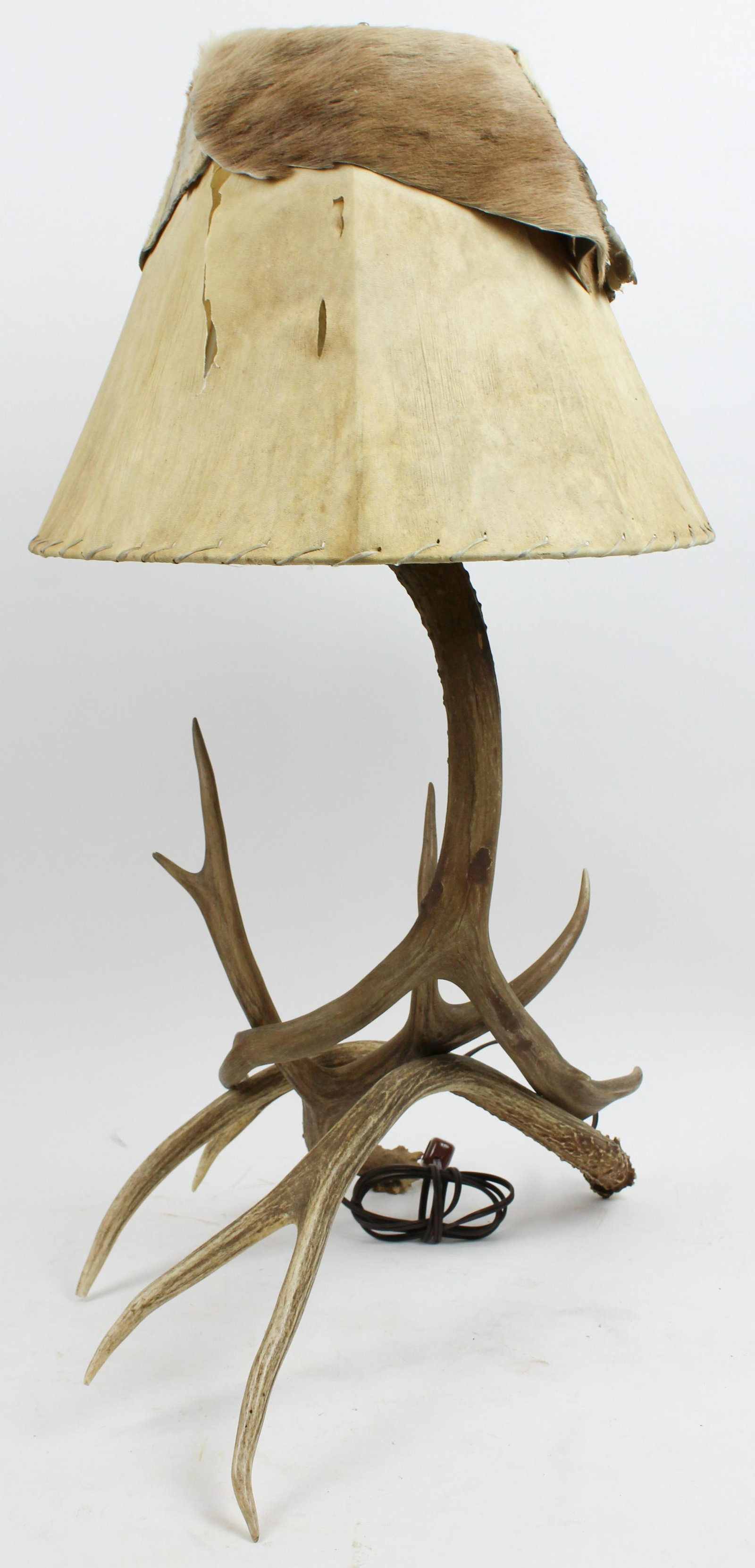 Deer Antler Lodge Style Table Lamp: Late 20th c. deer antler lodge style table lamp with hyde covered shade -some splitting to shade 32" x 15"