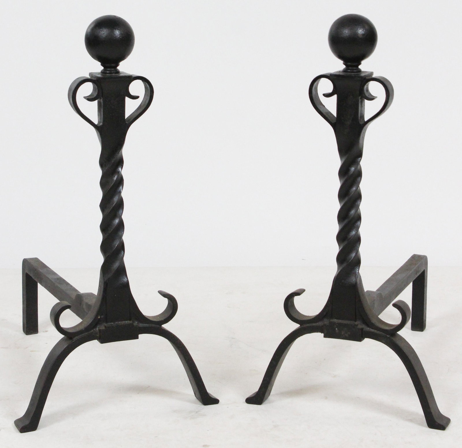 Pair of Arts and Crafts Twist Stem Andirons: Pair of Arts and Crafts era wrought iron andirons having twist column stem surmounted by a ball finial, in excellent cleaned condition 20.5" x 10.5" x 16"