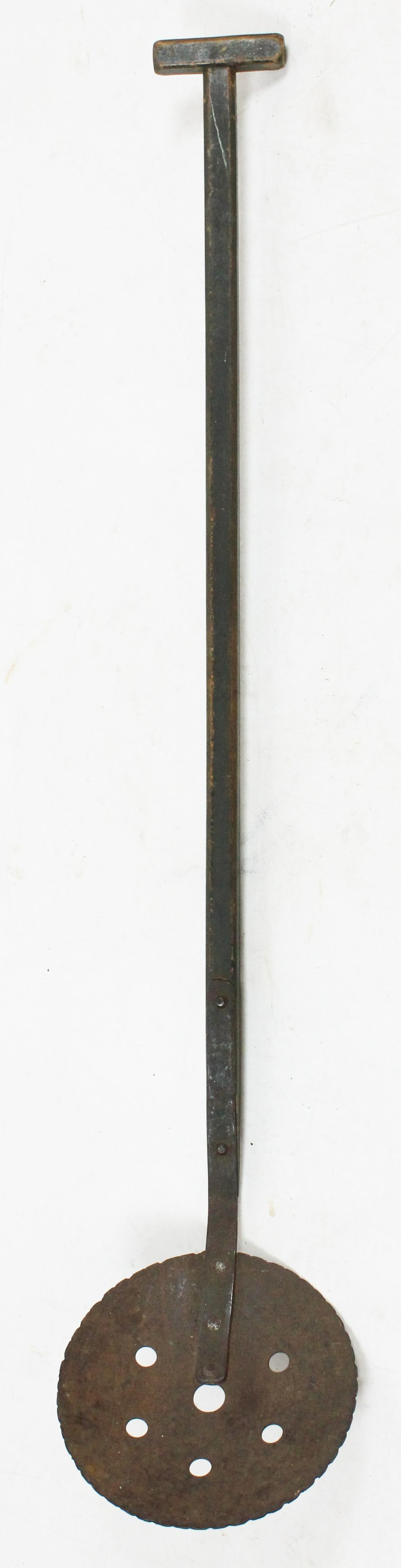 Outstanding 19th C Ice Scoop: A 19th c eel fishing ice scoop. Hand forged scoop and mounts. Ash handle in original green paint with T form end grip. 10" diameter iron scoop, 4 feet total length. Most likely used an a eel fishing s