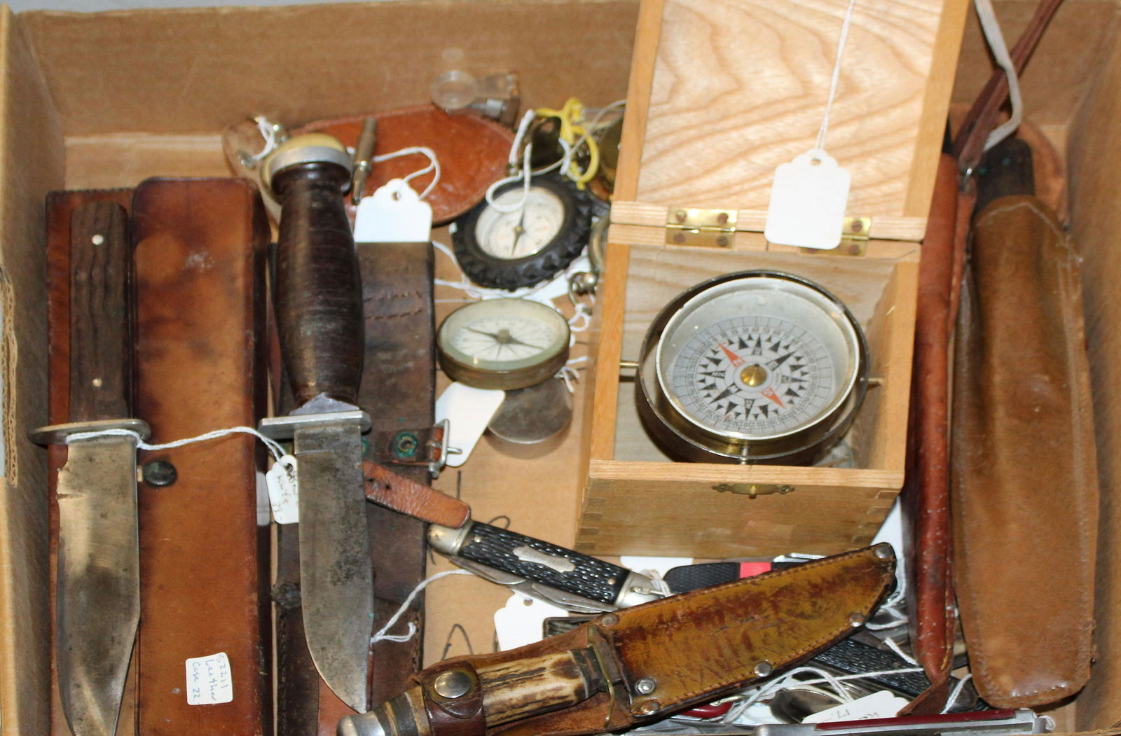 Vintage Knives & Compasses: A group of 17 vintage knives and 10 various early compasses. Including a Edge Brand 461 stag handle, Schrade Walden NY H-15, several pocket knives, a Sabre Bowie knife, brass compasses, boxed ship com
