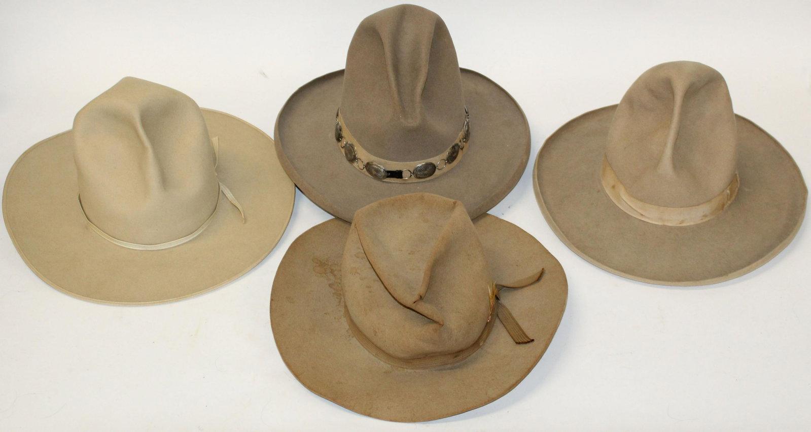 Two Stetson Western hats And Two Other Hats: Two vintage Stetson Hats, One Marked John B. Stetson in as found conditon, one marked Stetson 3X Beaver Quality 7 1/4 size with Wilensky Bros Menard Texas marked inside band. With grosgrain band and b