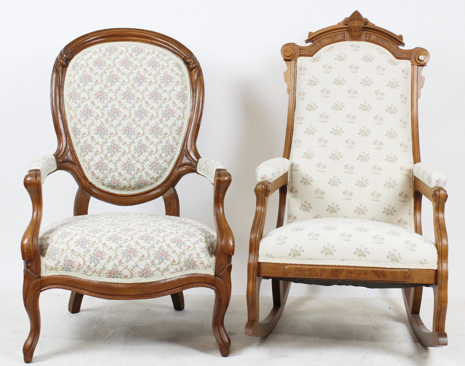 Victorian Walnut Rocker and Armchair: Two Victorian walnut parlor chairs including Renaissance Revival style rocking chair with burl panels, and finger carved balloon back gent's armchair, both in newer upholstery, very solid ht. 43", 40"