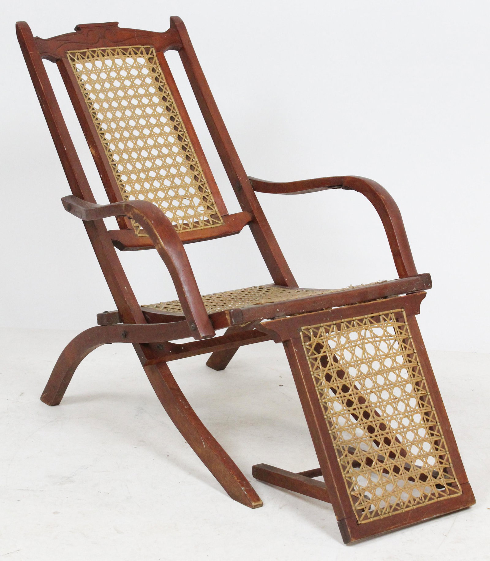 Victorian Childs Folding Deck Chair: Victorian cherry folding steam ship or occean liner deck chair with incised carving on crest, replacement vinyl cane 24" x 29" x 17"
