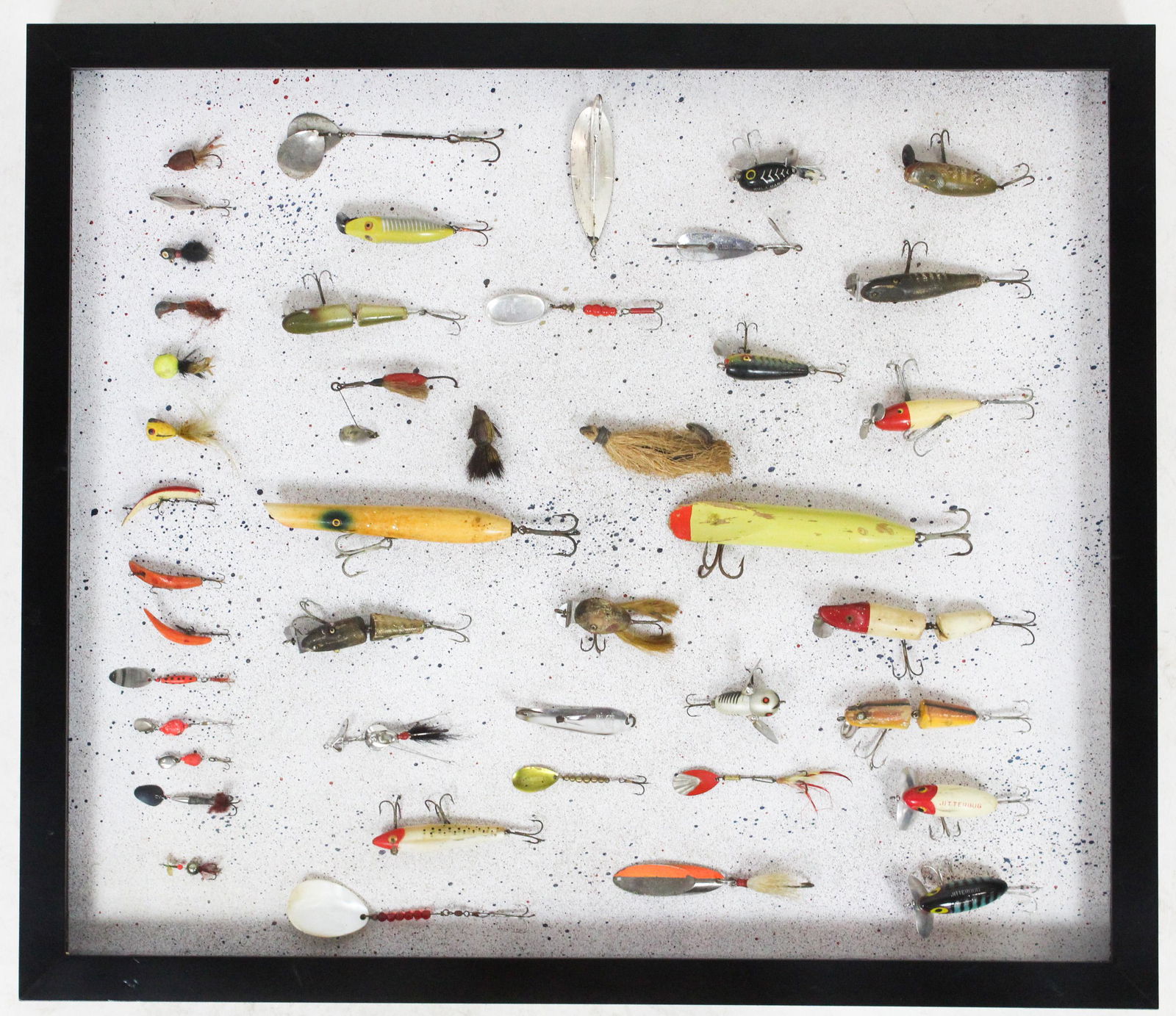 Framed Shadow Box Collage of 1940's Fishing Lures: Framed shadow box collage of 1940's and 50's fishing lures including Johnson's Silver Minnow, L.B. Huntington Drone, Shannon, Tony Accetta, Jitterbug, etc. 44 pcs. total 30.5" x 26"