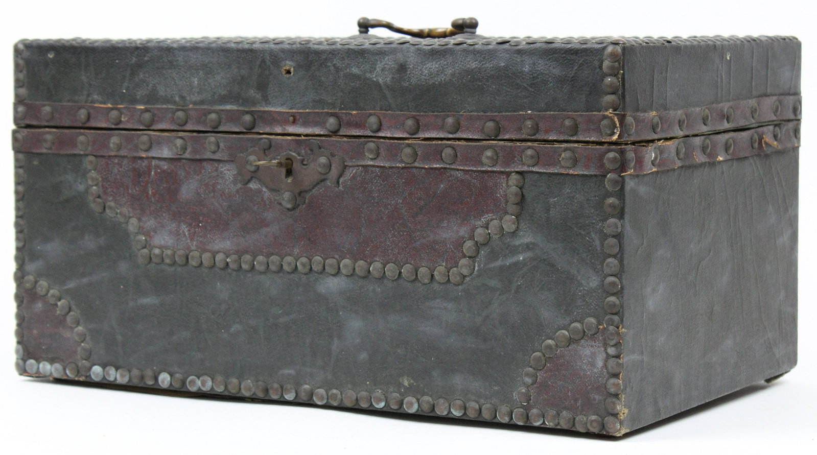 Early 19th c Hide Covered Trunk: Small early 19th c hide-covered trunk, two-toned leather with brass studs, decorative paper lining, with key, 16 1/2" x 10" x 8 1/2"