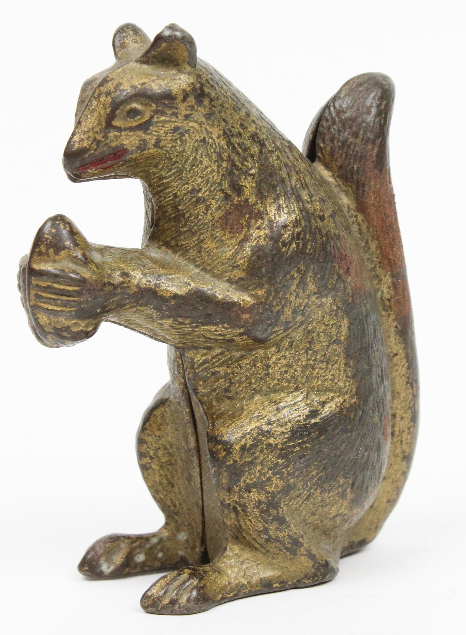 Cast Iron Squirrel with Nut Still Bank: Cast iron squirrel with nut still bank, good condition, slight paint wear, ht 4 1/4"