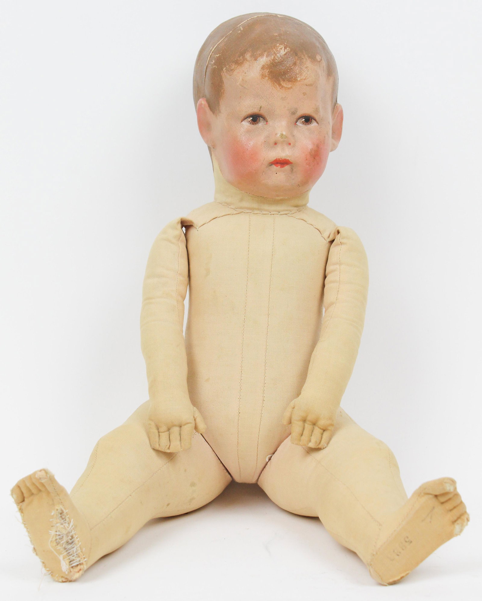 Martha Chase Stockinette Cloth Doll: Early 20th c Martha Chase stockinette cloth boy doll, ht 17", old stitched repairs on one foot