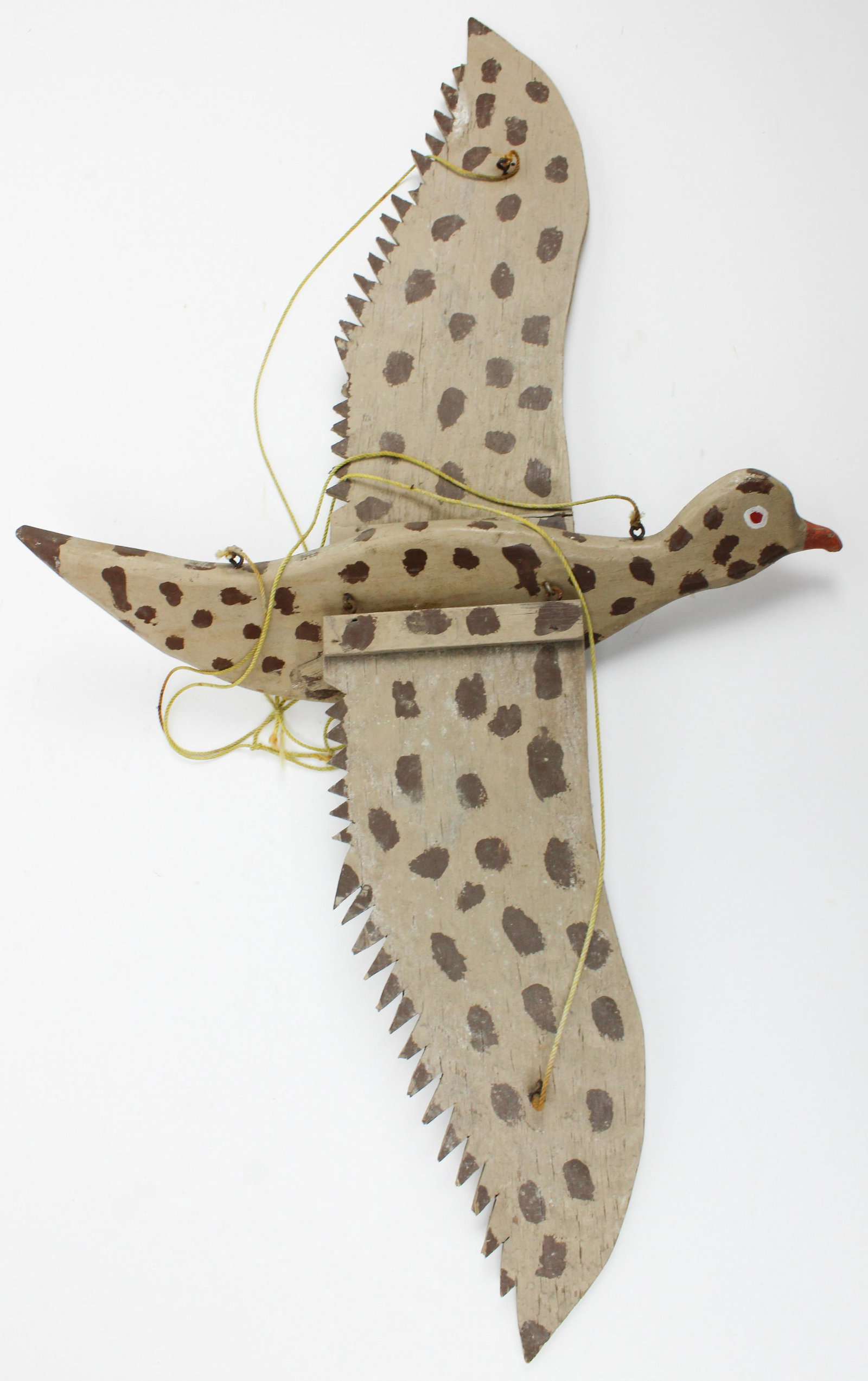 Folky Painted Flying Bird with Jointed Wings: Folky painted wooden bird with jointed wings, feet lost, length 16 1/2", wingspan 30"