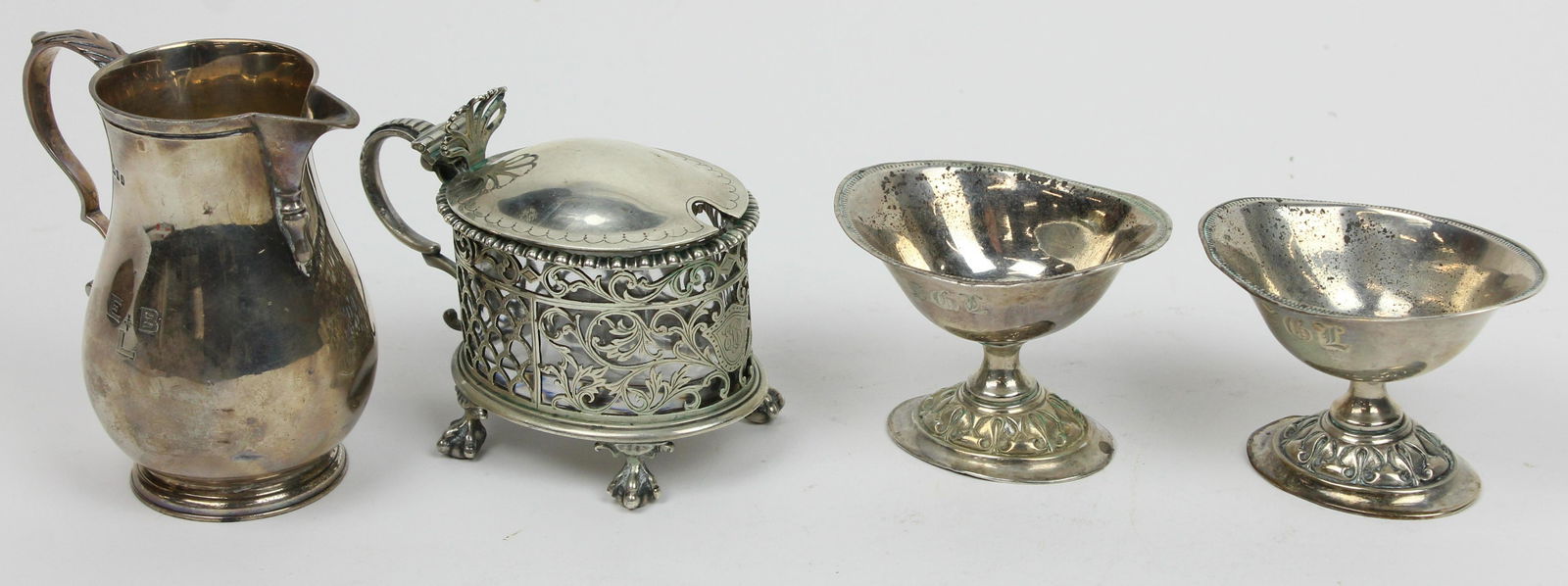 4 pcs. English and Continental Silver Hollowware: 4 pcs. English and Continental Silver Hollowware including fine 1904 London reticulated mustard pot with glass liner, gadrooned edge and ball and claw feet, London cream jug Charles Stuart Harris reta
