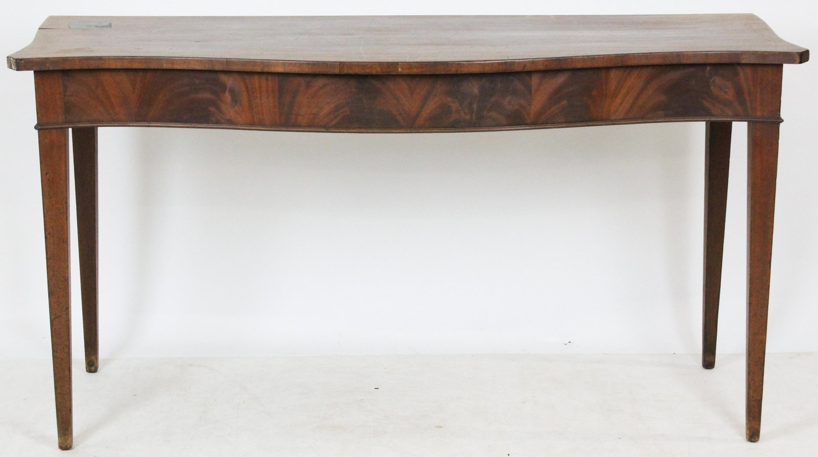 Hepplewhite Mid-Atlantic Console Table: Ca 1800 Hepplewhite Mid-Atlantic mahogany serpentine front console table/ server, length 62", ht 33", max depth 23", few veneer losses