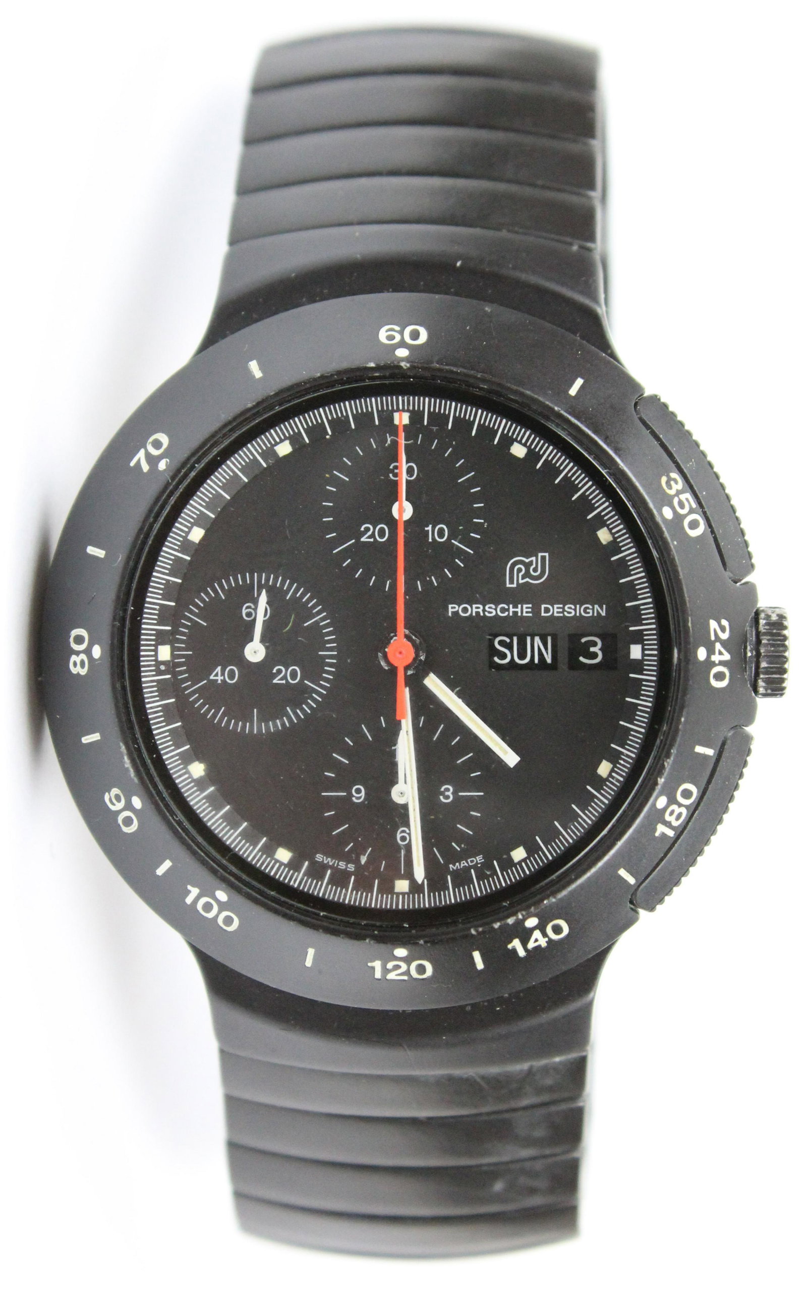 Porsche Design Wrist Watch: Porsche Design wrist watch. Automatic, stop watch function, black face, black metal band, 42 mm diameter, has a IWC tag Ref. 3781 Case Nr. 2.340.216. With a black leather round case and fitted interio