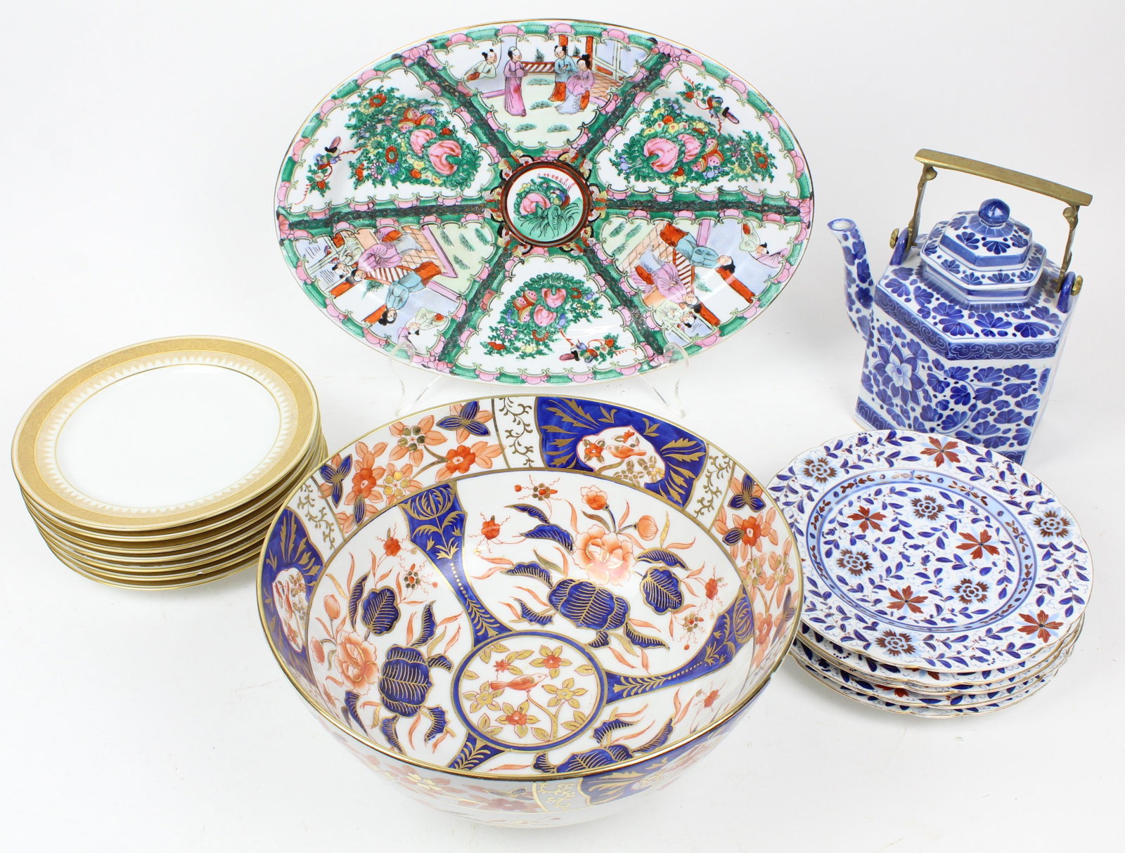 Group of Asian and European Porcelain Tableware: Group of Asian and European porcelain tableware including 5 cobalt decorated plates with Austrian beehive mark, 6 Limoges Luncheon plates with gold engraved borders, large 20th c. Imari style punch bo