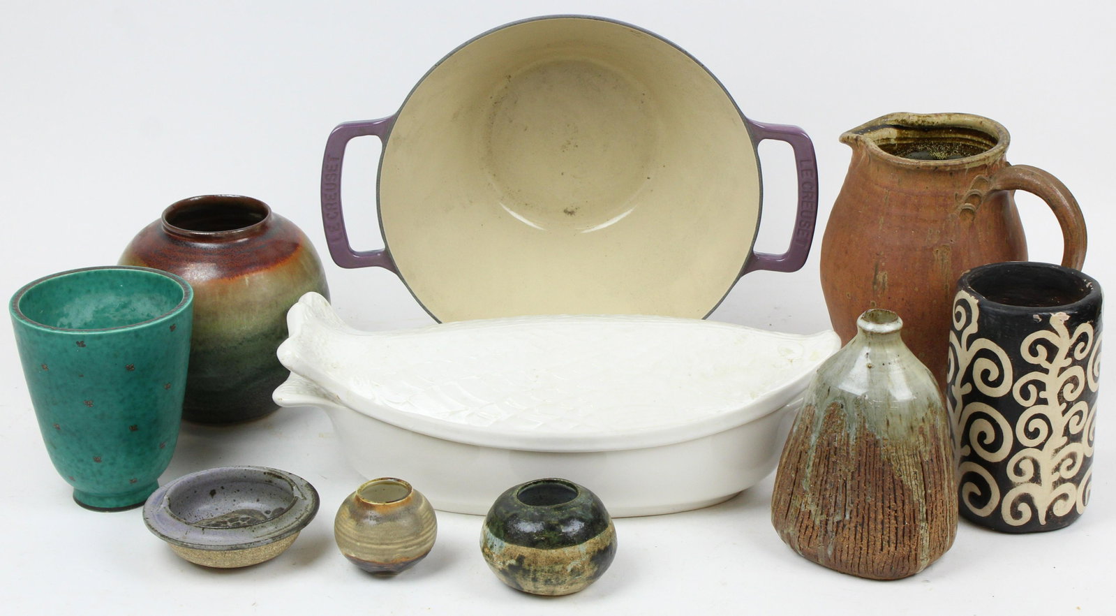 Mid Century Studio Art Pottery and Cookware: Lot of mid century modern studio art pottery and contemporary cookware including Gustavsberg Argenta silver inlaid vase (chip to base) Eliza Branman signed vessel and other items marked with monograph