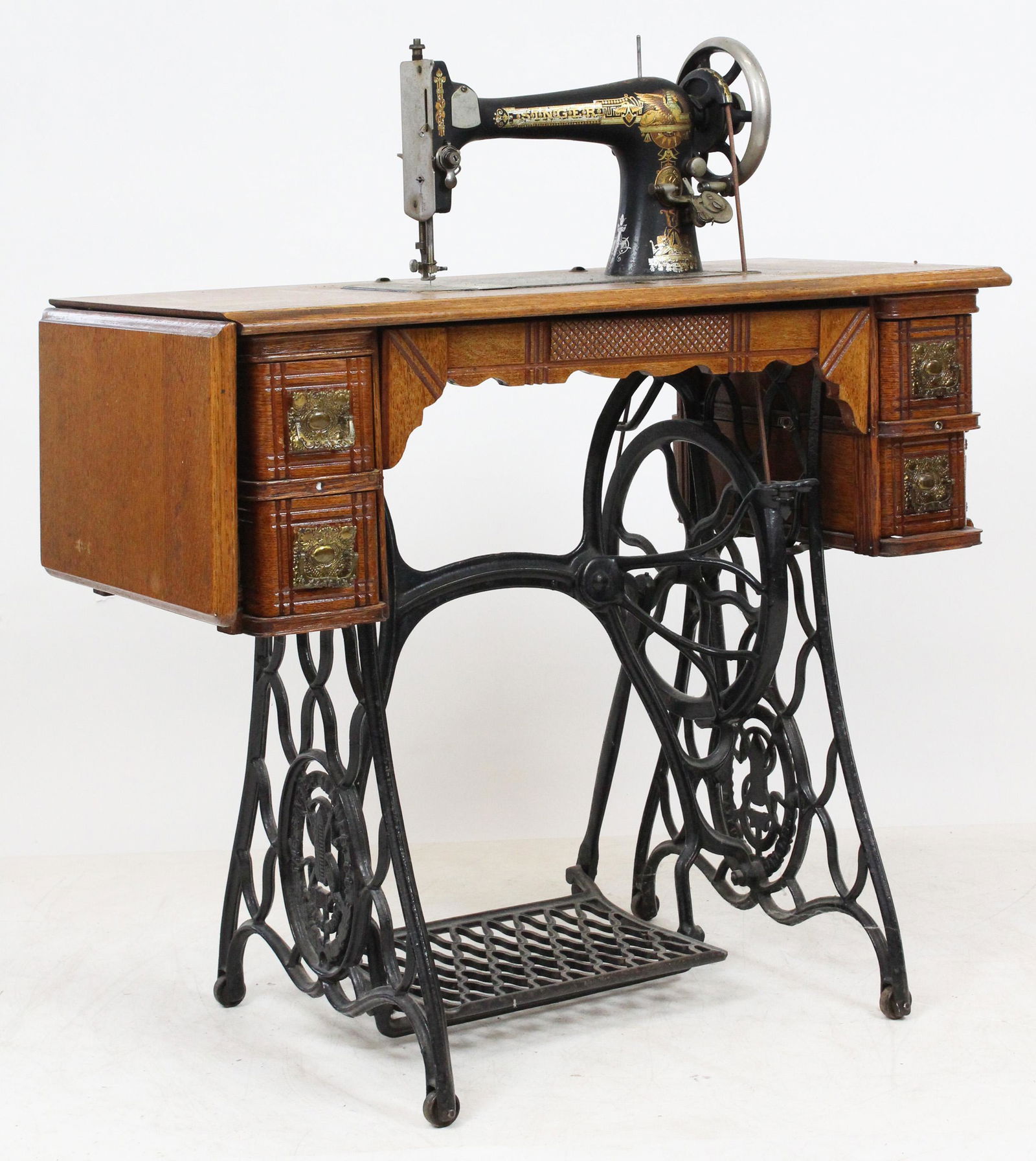 Singer Egyptian Revival "Sphinx" sewing machine: Circa 1909 Singer Sphinx Egyptian Revival treadle Sewing machine 34 x 41 x 16"