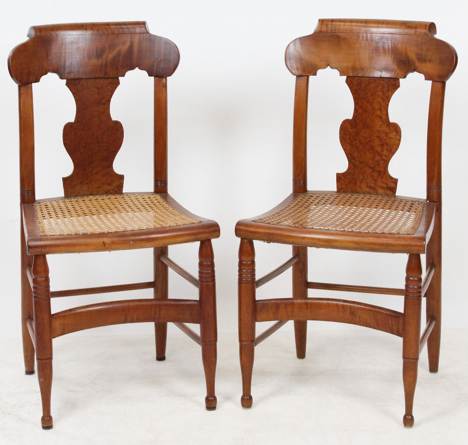 Pair of Sheraton Tiger Maple Side Chairs: Pair of Sheraton Tiger Maple side chairs with fiddle backs and turned legs and caned seats, in excellent restored condition 35" x 17" x 15"