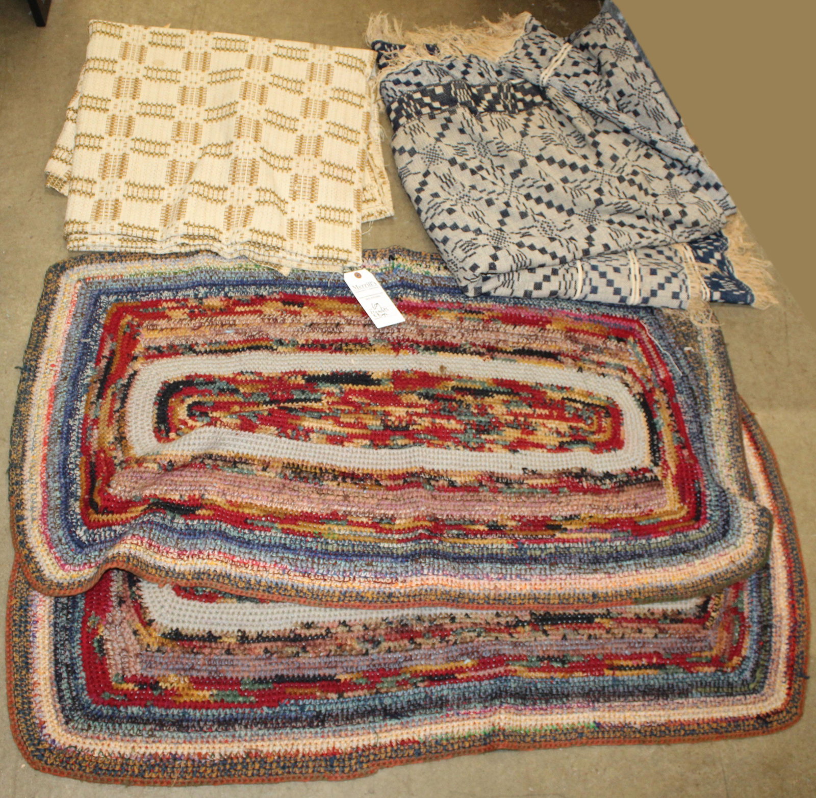 Two Homespun Coverlet: Two homespun coverlets, one tricolored 77 x 94", one blue and white with cut corners for bed posts 96 x 94" excluding fringe, two 24 x 29" Knitted rugs