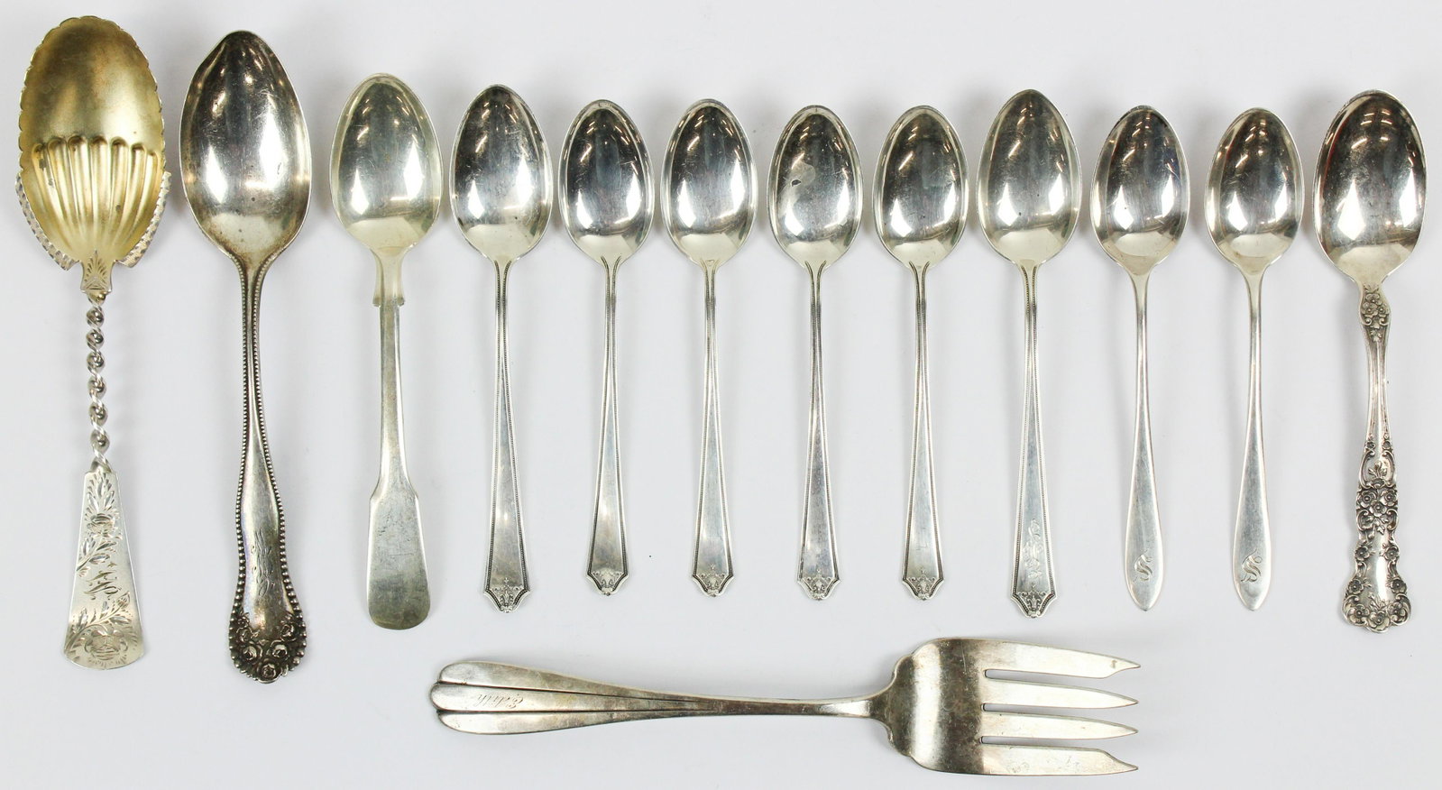 13 pcs. Assorted Sterling Silver Flatware: Group of 13 pcs. assorted sterling silver flatware including Gorham Lancaster tablespoon, Gorham Cambridge tablespoon, 6 Jennings Silver Co teaspoons, Victorian bright cut and twist stem serving spoon
