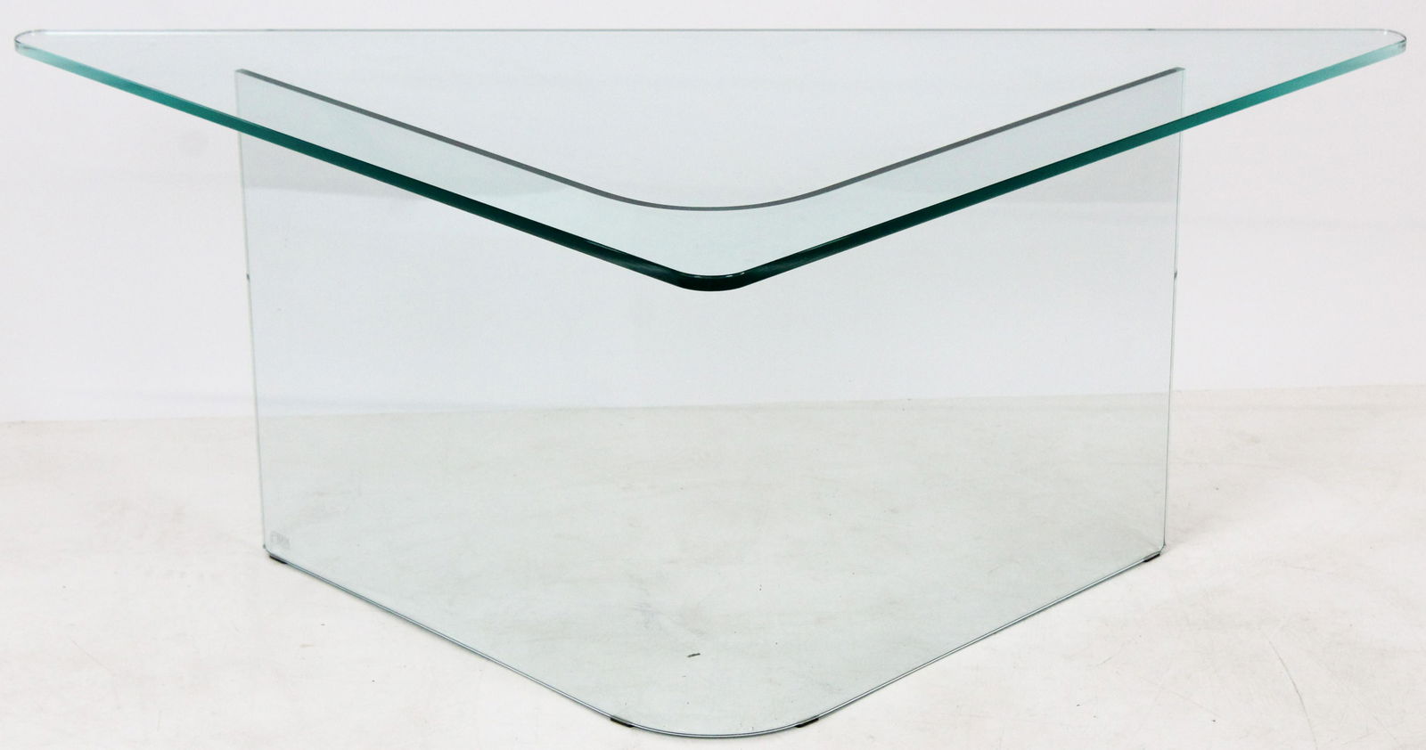 Fiam Italia Modern Coffee Table: Mid century modern plate glass corner table. Curved corner glass base with open side, triangular plate glass top. 47" l, 24" deep, 18" high. With acid etched makers mark