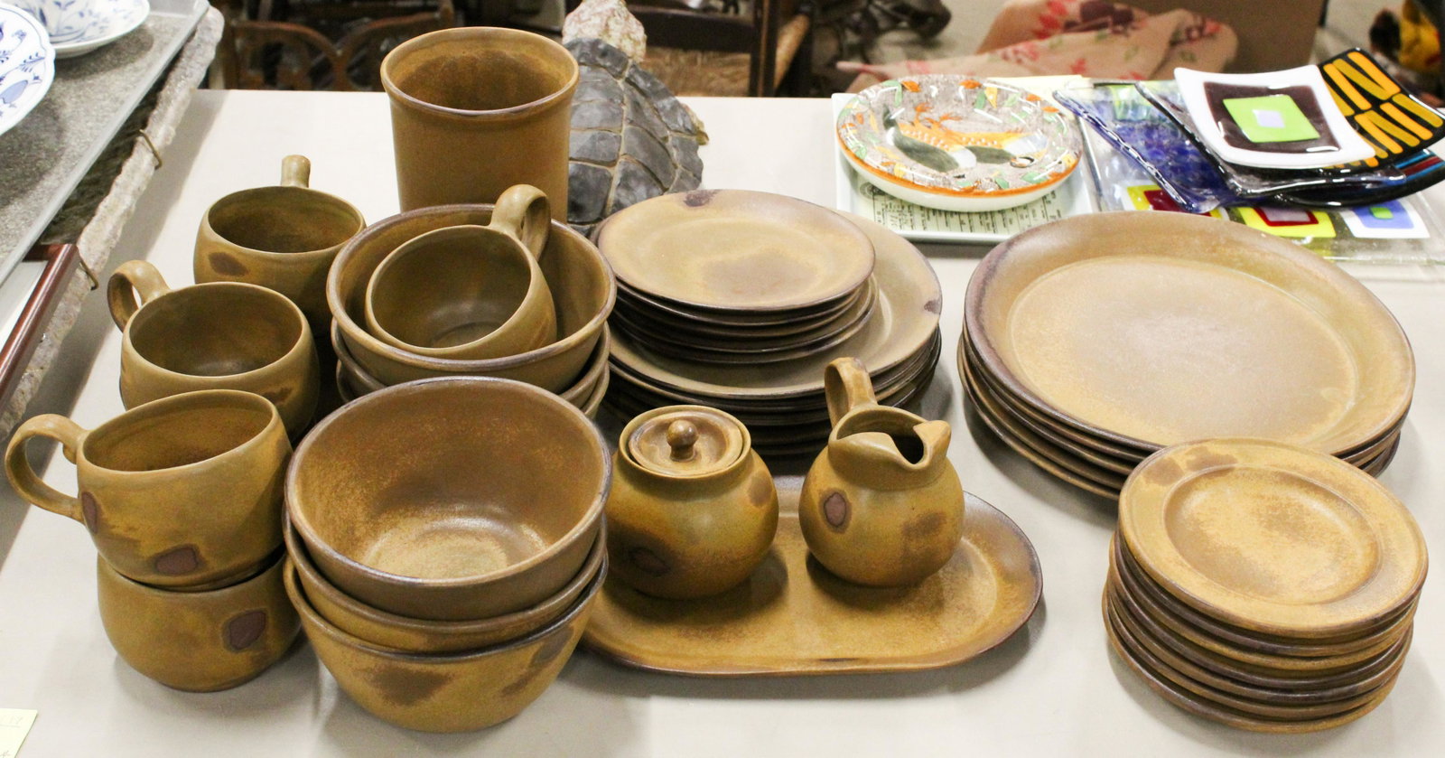 39 pcs. Bennington Potters Tavernware: 39 pcs. Bennington Potters "Tavernware" contemporary rustic glaze dinnerware including mugs, dinner plates, sugar and creamer set, oval tray, bowls, etc.