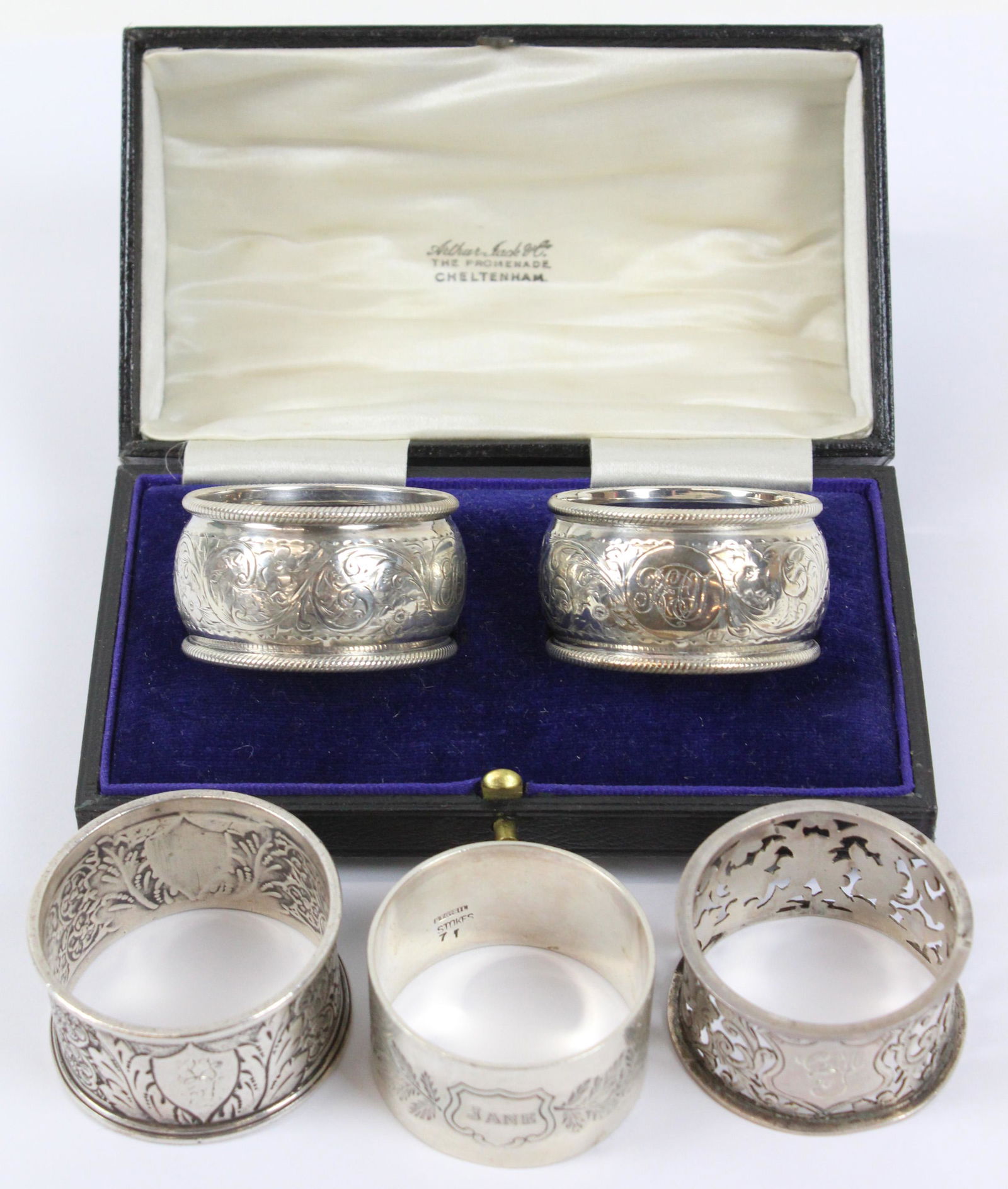5 Victorian Ornate Sterling Napkin Rings: Group of 5 Victorian ornate sterling silver napkin rings including matched pair with English Chester hallmarks in fitted presentation case, and 3 individual rings