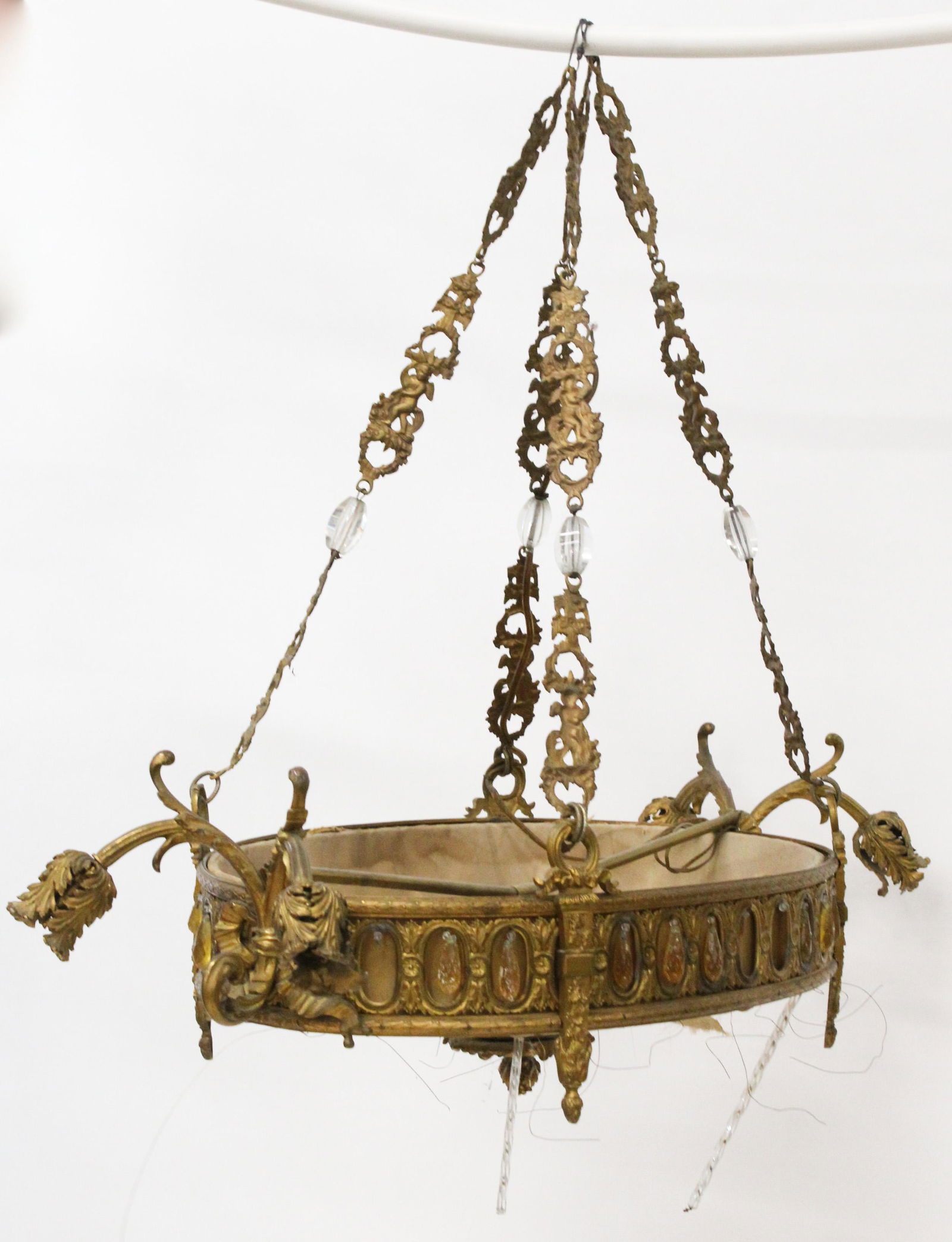 Italianate Gilt Brass Oval Hanging Light Fixture: 1920's Italianate gilt brass oval hanging light fixture, amber prisms, twisted glass canes, some losses, overall length 32"