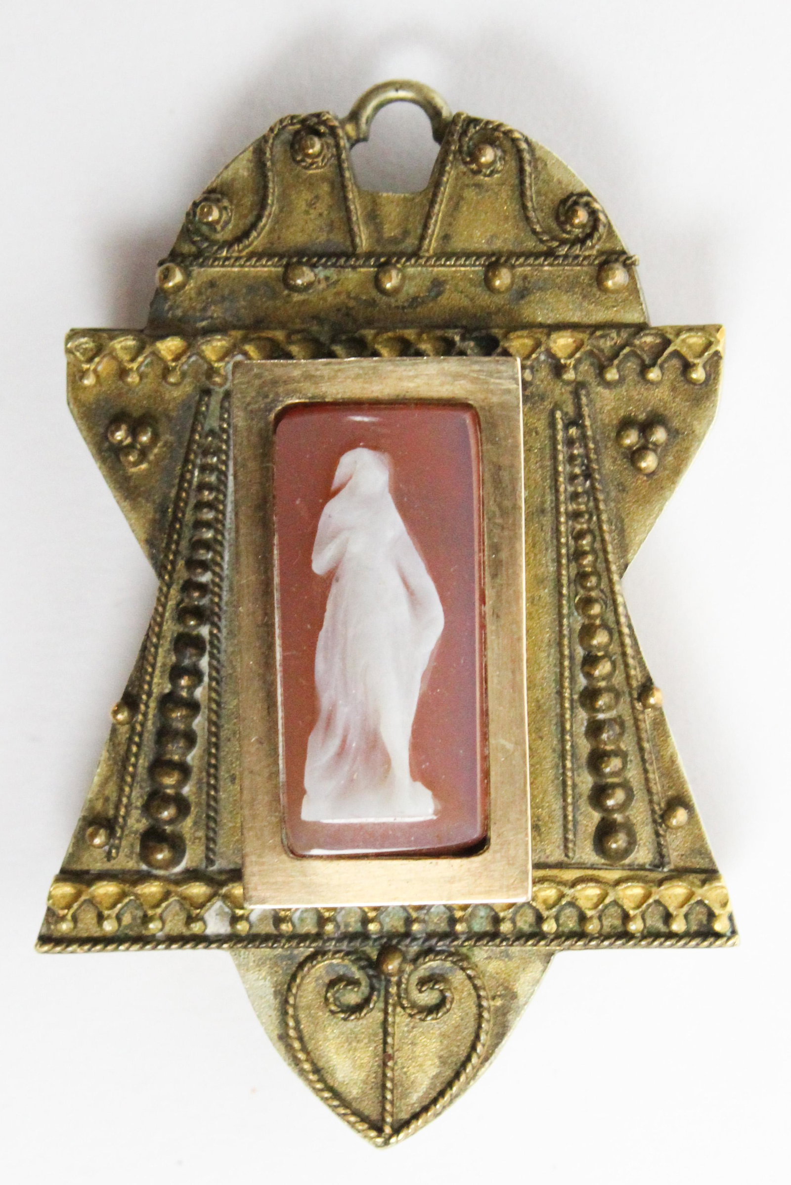 Victorian Cameo Locket / Pendant: A Victorian yellow gold cameo locket / pendant. Front cameo panel with full length classical female figure, 17 mm x 8 mm. Bead and wire decorated frame, 1 3/4" long x 1 1/8" wide. Back of locket opens