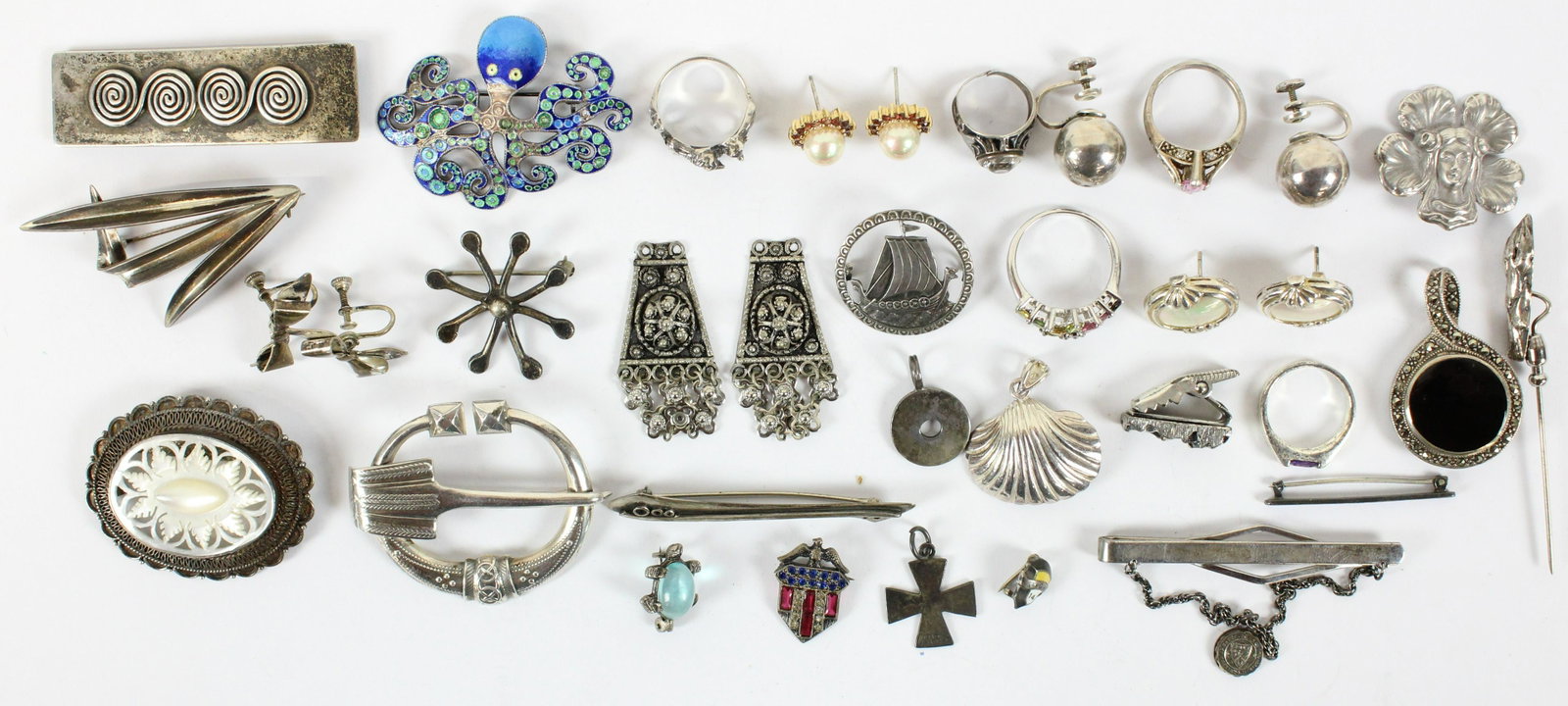 Group of Fine Sterling Jewelry: A group of sterling jewelry including a octopus enamel decorated brooch pin, Victorian m.o.p pin, marcasite, signed scarf pins, Art Nouveau pins, earrings, bracelets, rings.