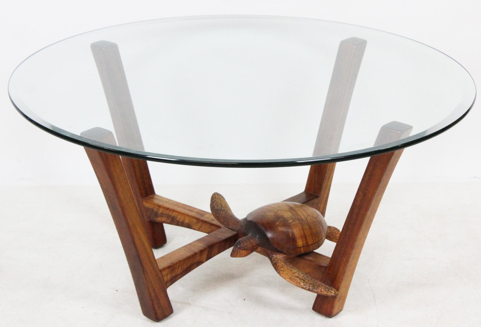 Jennifer Schwarz Carved Turtle Coffee Table: 2003 Jennifer Schwarz carved wooden sea turtle coffee table, signed and dated on base, with round beveled glass top, diameter 38", ht 18 1/2"