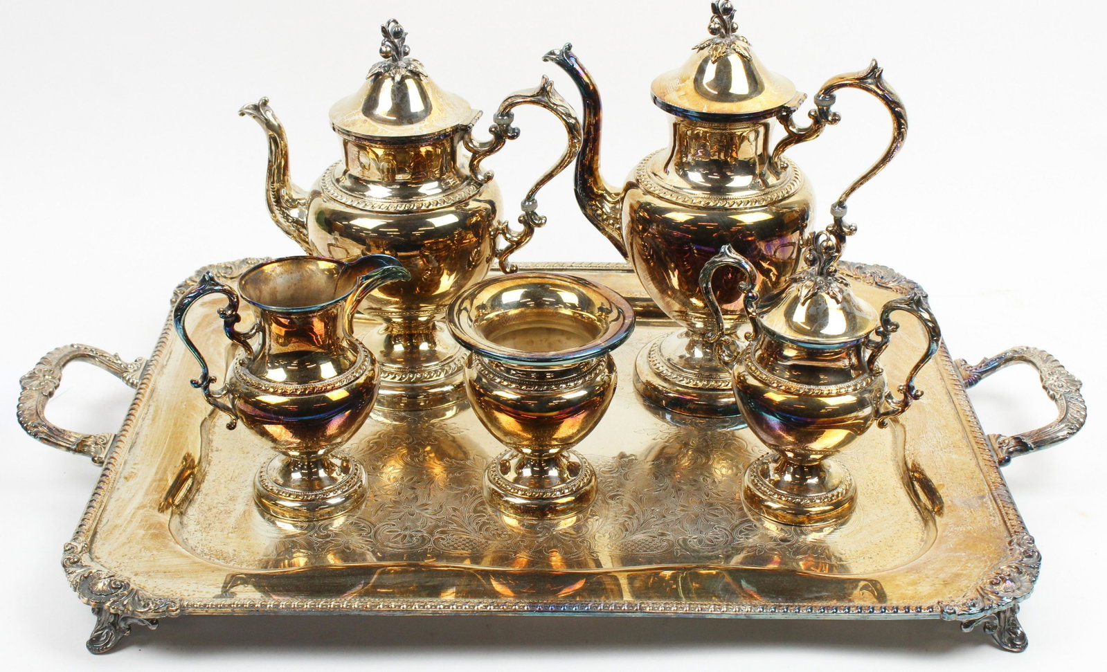 6 pc. Sheffield Silver Plated Tea Service: 6 pc. Ornate early 20th c. Sheffield type silver-plated tea service consisting of coffee pot, tea pot, sugar bowl, waste bowl, and large double handled serving tray, all items with gadrooned rims ht. 