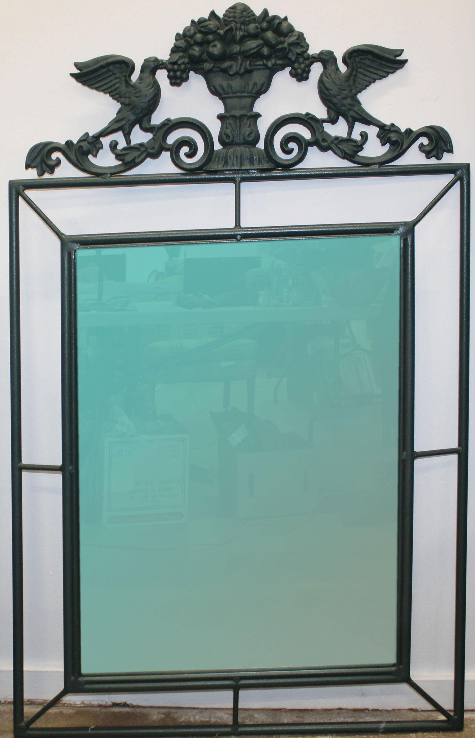 Cast Iron Decorative Mirror: Cast Iron Decorative mirror with dove and bouquet at crest 54 x 33"