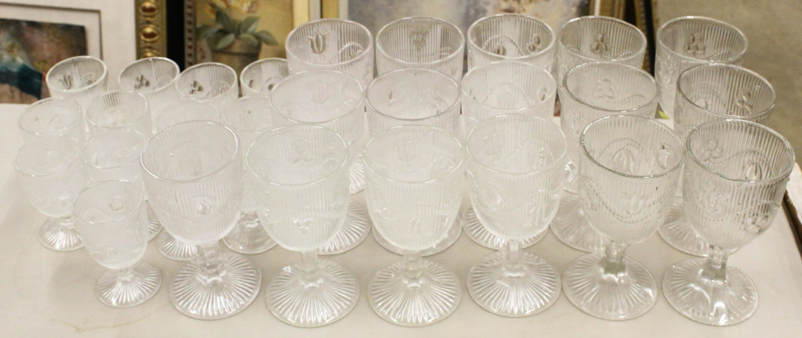 29 pcs. Ribbed Bellflower Pattern Glass Stemware: Lot of 29 Ribbed Bellflower Early American Pattern Glass EAPG stemware including 16 water goblets and 13 small dessert wine goblets ht. 4", 6"