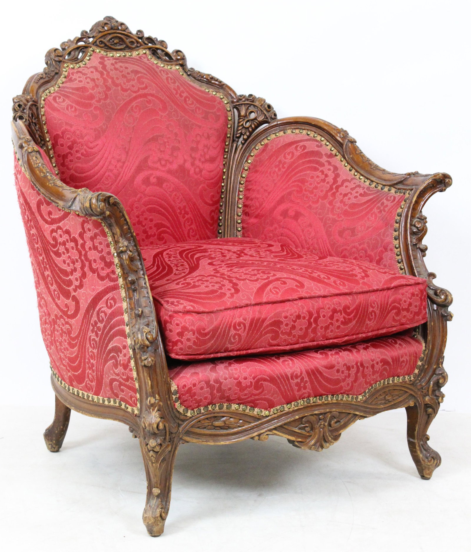 ca. 1920 Italian Carved Bergere Armchair: ca. 1920 Italian ornately carved bergere style armchair in vintage red woven upholstery 37" x 36" x 32"