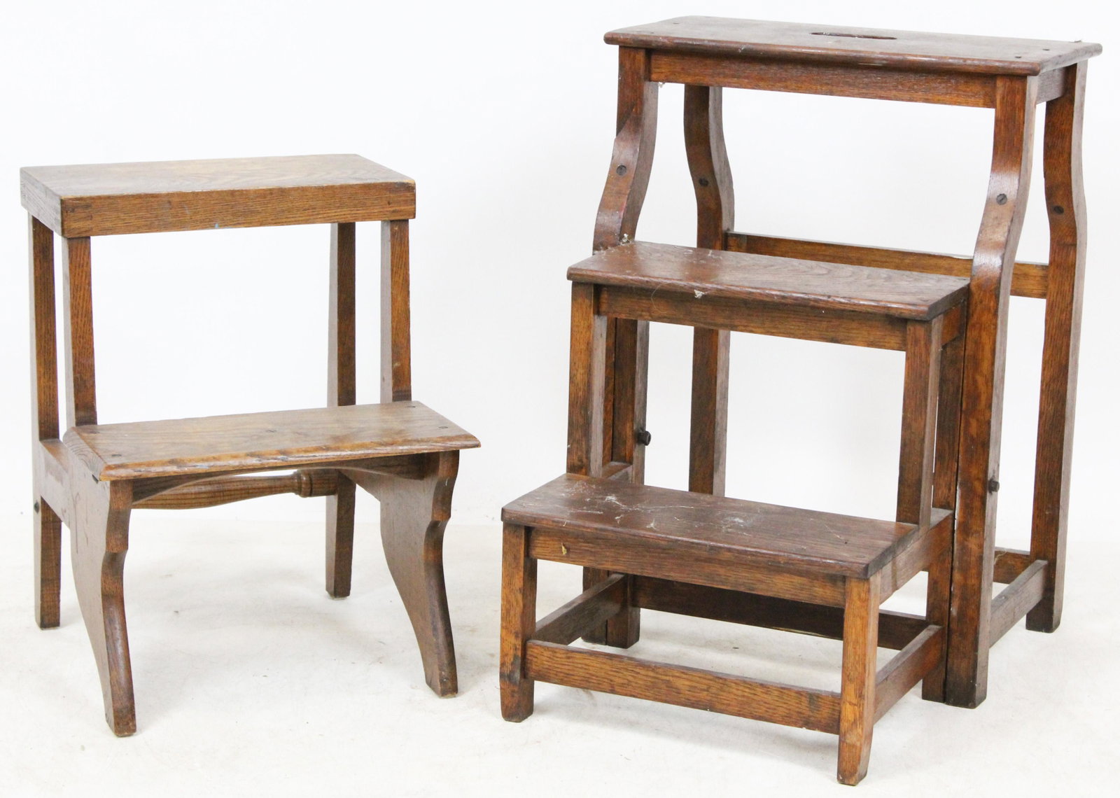 2 Sets of ca. 1910 Oak Pantry Steps: 2 sets of ca. 1920 oak pantry steps, one having fold out steps, the other stationary, in old finish ht. 18.5"-24"