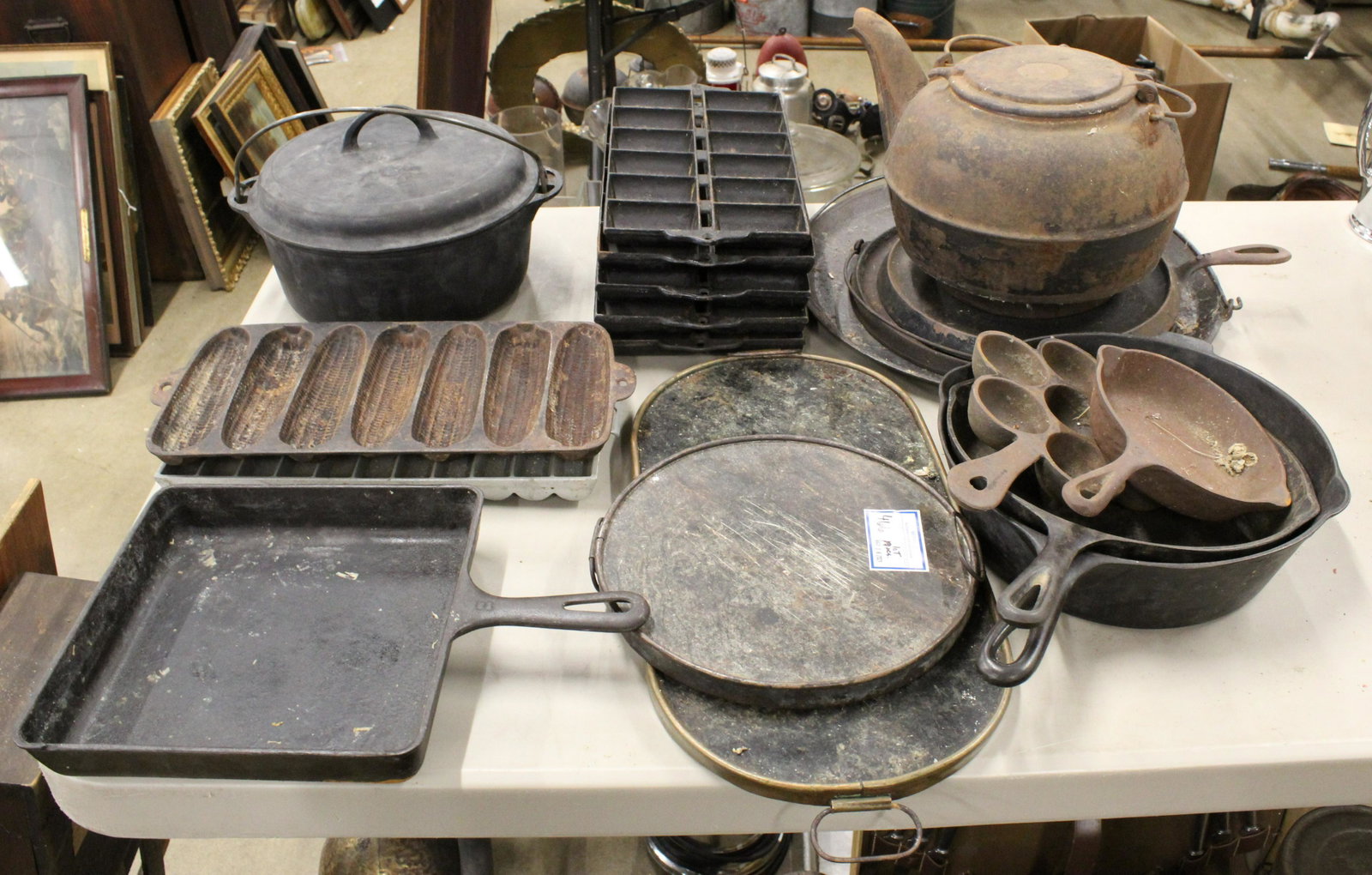 Collection of Cast Iron Cookware incl. Griswold: Large collection of 16 pcs. cast iron cookware including Griswold large block logo Tite Top dutch oven, Griswold square skillet, 6 corn bread pans, Wagner Ware deep frying skillet, 3 griddles, large t