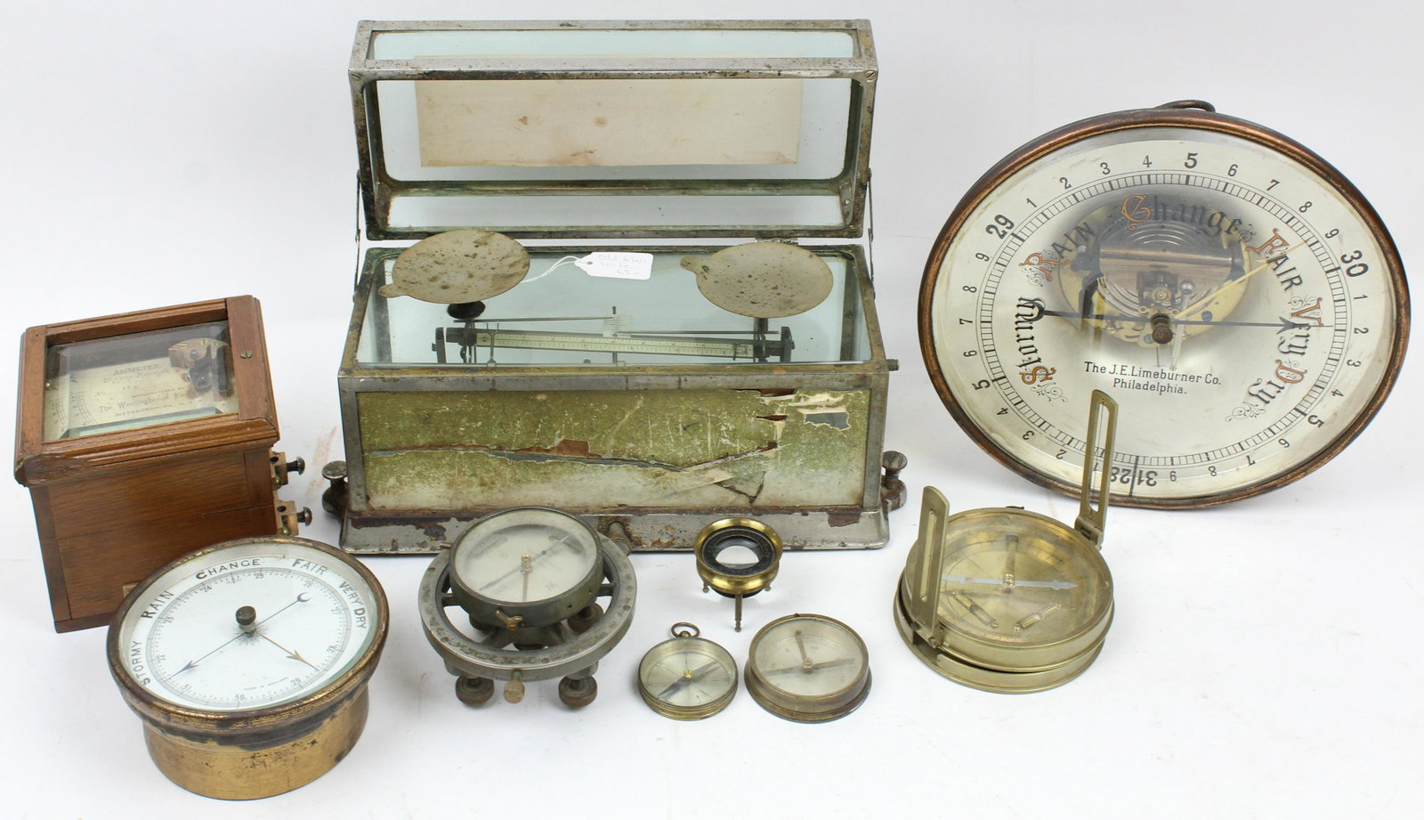 Group of Barometers and Early Technical Devices: Group of barometers and early technical devices including J.E. Limeburner Philadelphia reverse painted beveled glass barometer, T. Cooke & Sons London brass compass, Keuffel & Esser silvered dial comp