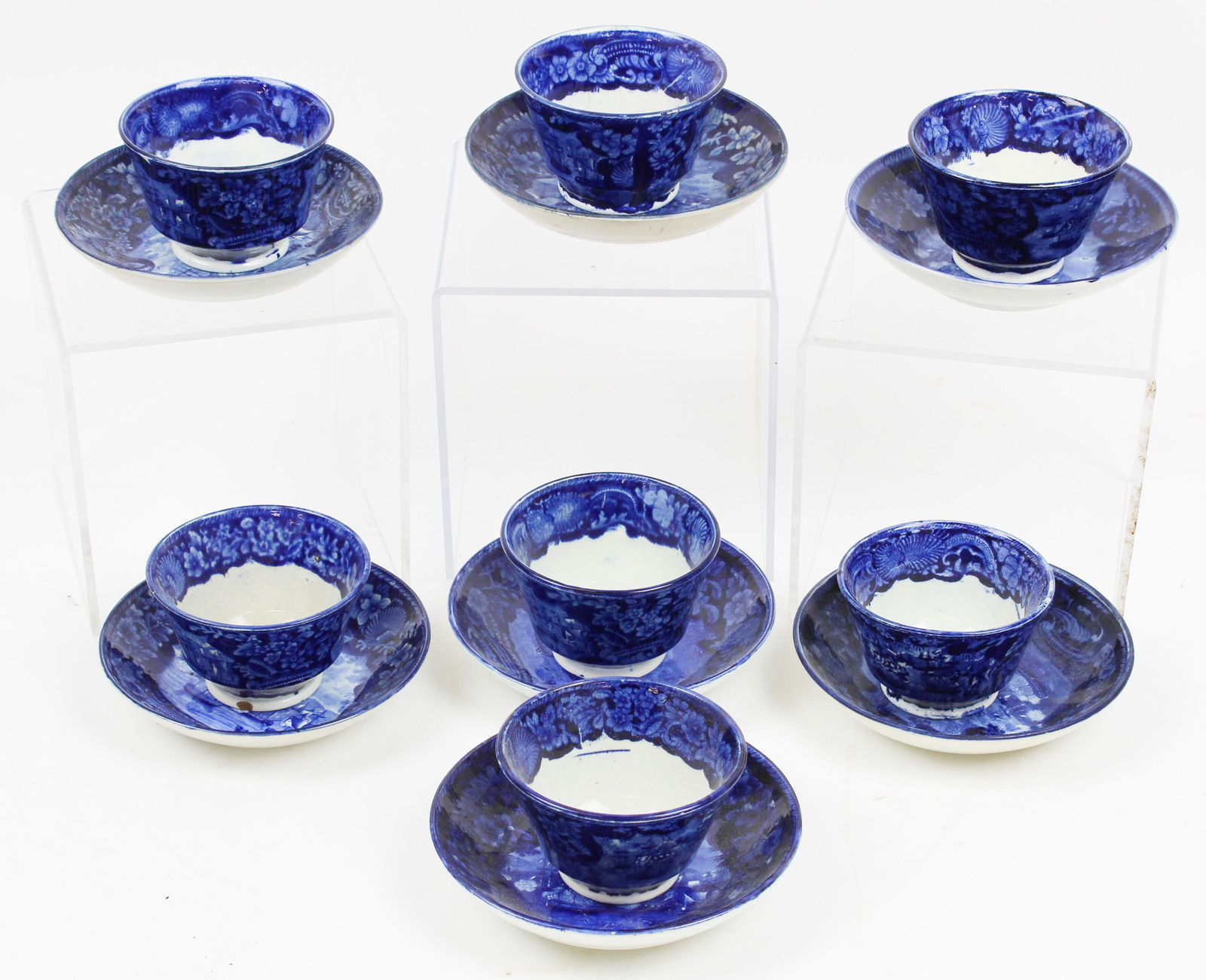 7 MacDonnough's Victory Tea Cups and Saucers: Collection of Seven 19th c. Deep Blue Historical Staffordshire transferware soft paste porcelain handleless teacups and saucers by Enoch Wood decorated with scenes depicting War of 1812 "Commodore Mac