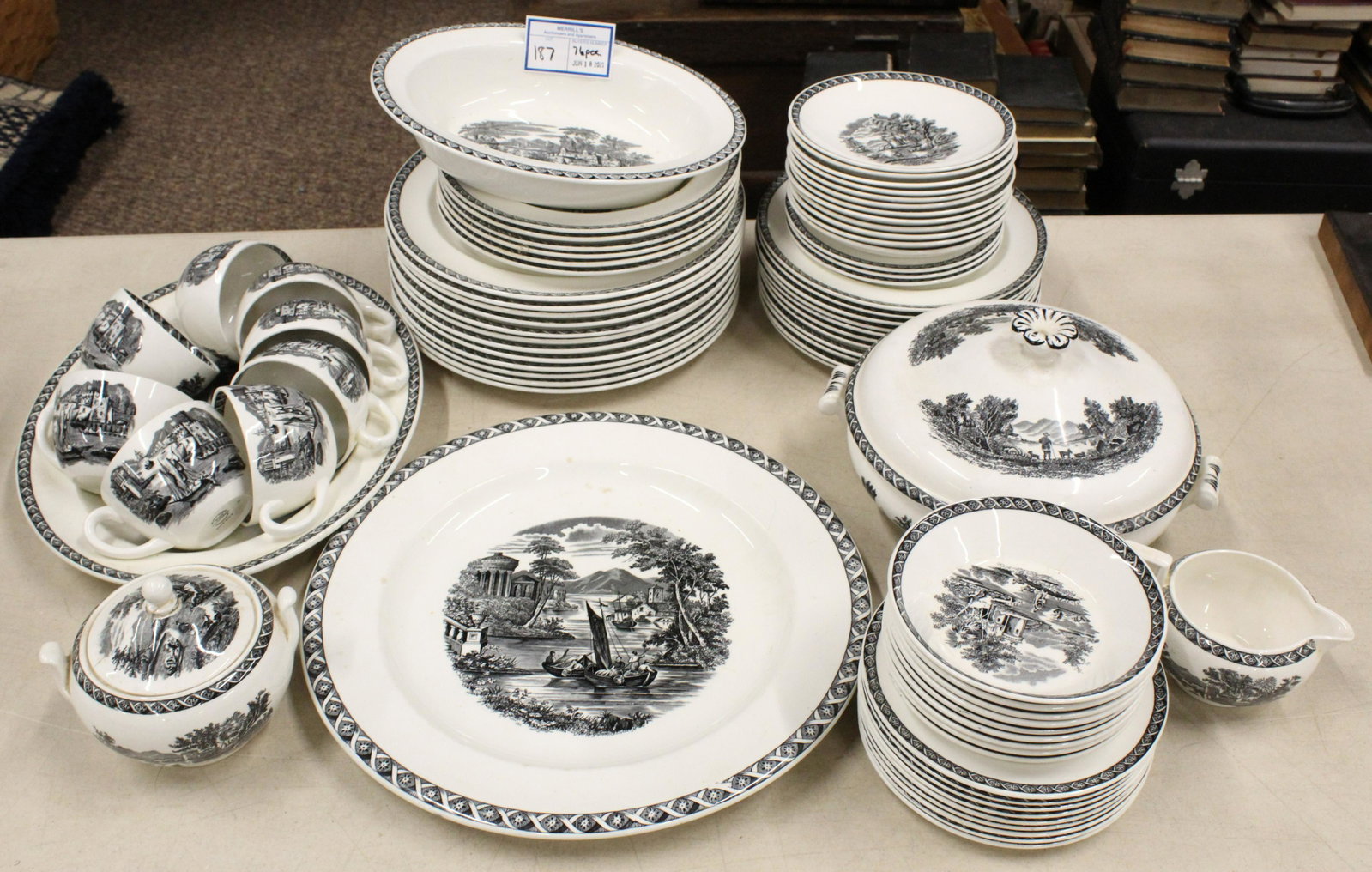76 pcs. Wedgwood Lugano Porcelain Dinnerware: 76 pcs. Wedgwood "Lugano" pattern porcelain dinnerware with black engraved scenic transfer decoration including serving platters, covered vegetable dish, sugar and creamer (lid repaired), cups and sau