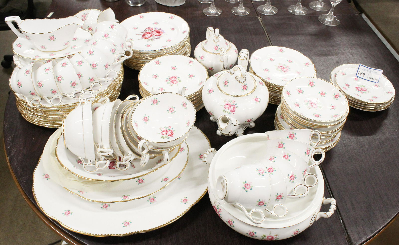 103 pcs. Royal Stafford Tudor Rose Dinnerware: 103 pcs. Royal Stafford "Tudor Rose" English bone china porcelain dinnerware with rose blossom floral decoration and gilt accents, including 3 pc. tea set, sauceboat and undertray, dinner plates, lunc