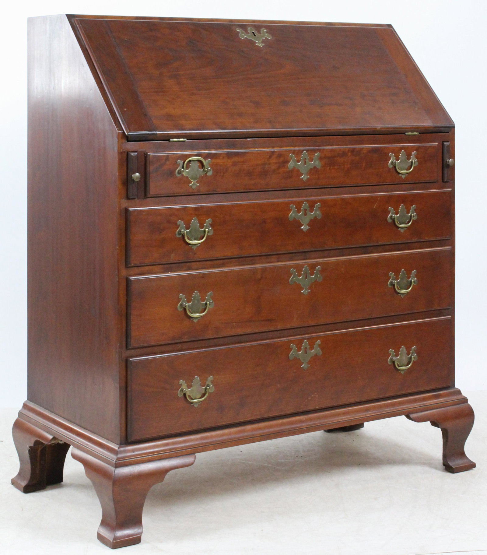 Eldred Wheeler Slant Front Desk: Signed Eldred Wheeler Hingham, MA Chippendale style cherry slant front desk. Fine fitted interior, slant front, 4 graduated lipped drawers, & ogee feet. Good overall condition. 35"w, 18" d, 41" h.