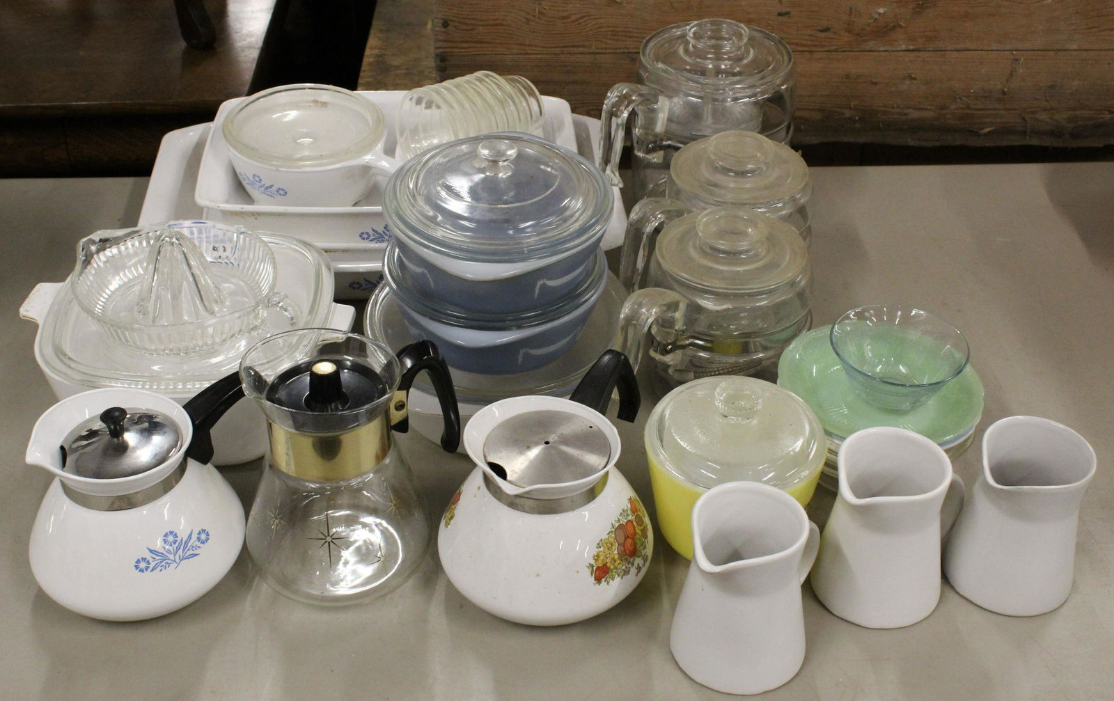 Group of Corningware and Kitchen Glassware: Group of kitchen glassware including 7 pcs. Corningware Cornflower Blue decorated bakeware and tea kettle, Corningware Spice of Life tea kettle, 2 Glasbake Gray Grecian covered casseroles, 3 Pyrex cof